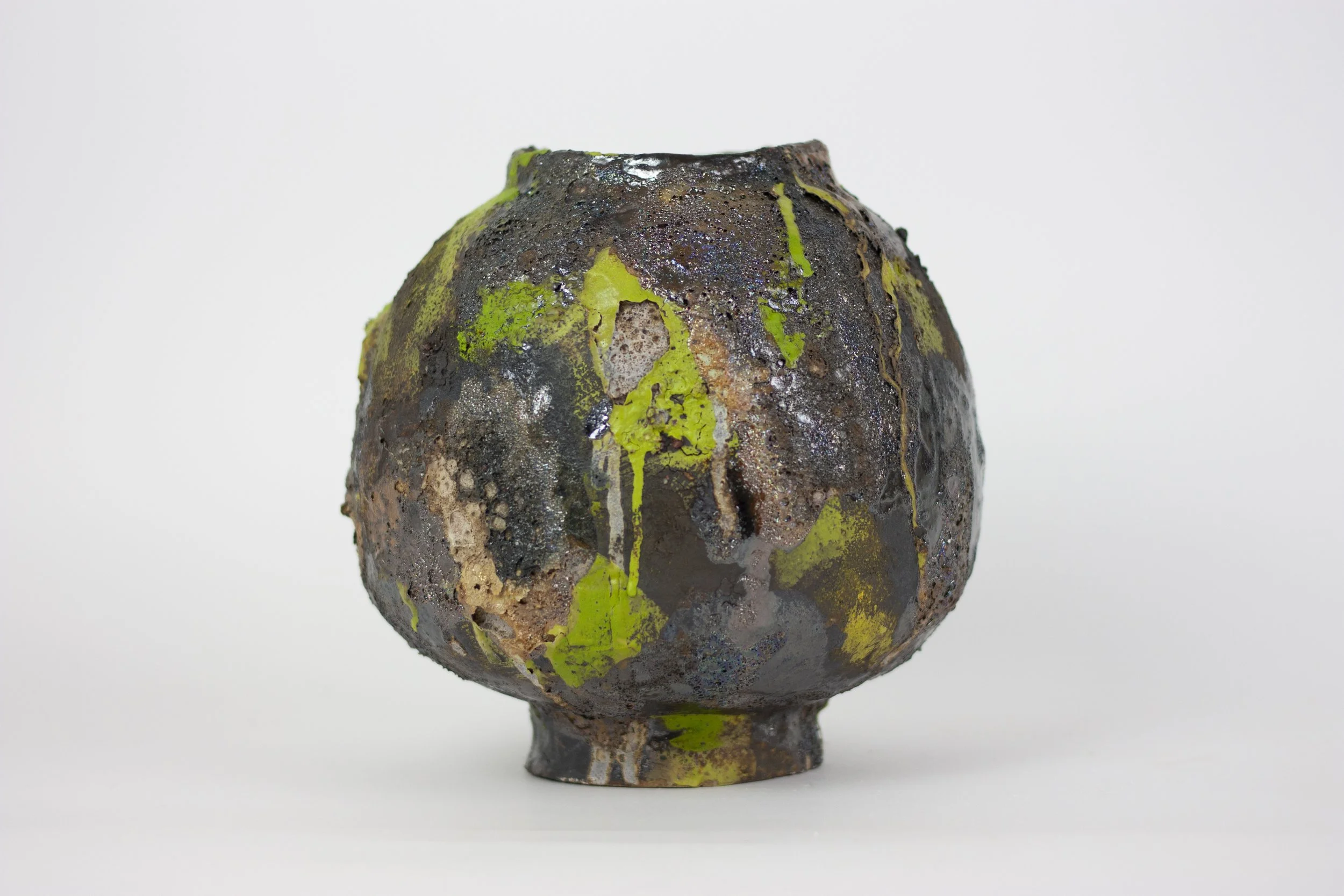 "Lichen Vessel," 2024. 10 x 10 x 10 inches. Ceramic, melted rock, glazes, slip.