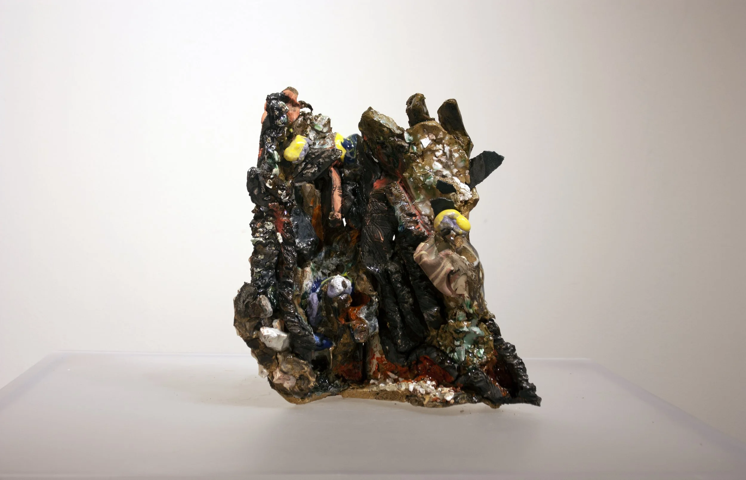 "Angry Strata" 2021-22. Press-molded recycled stoneware, steel shards, gravel, glaze, and found bisque.