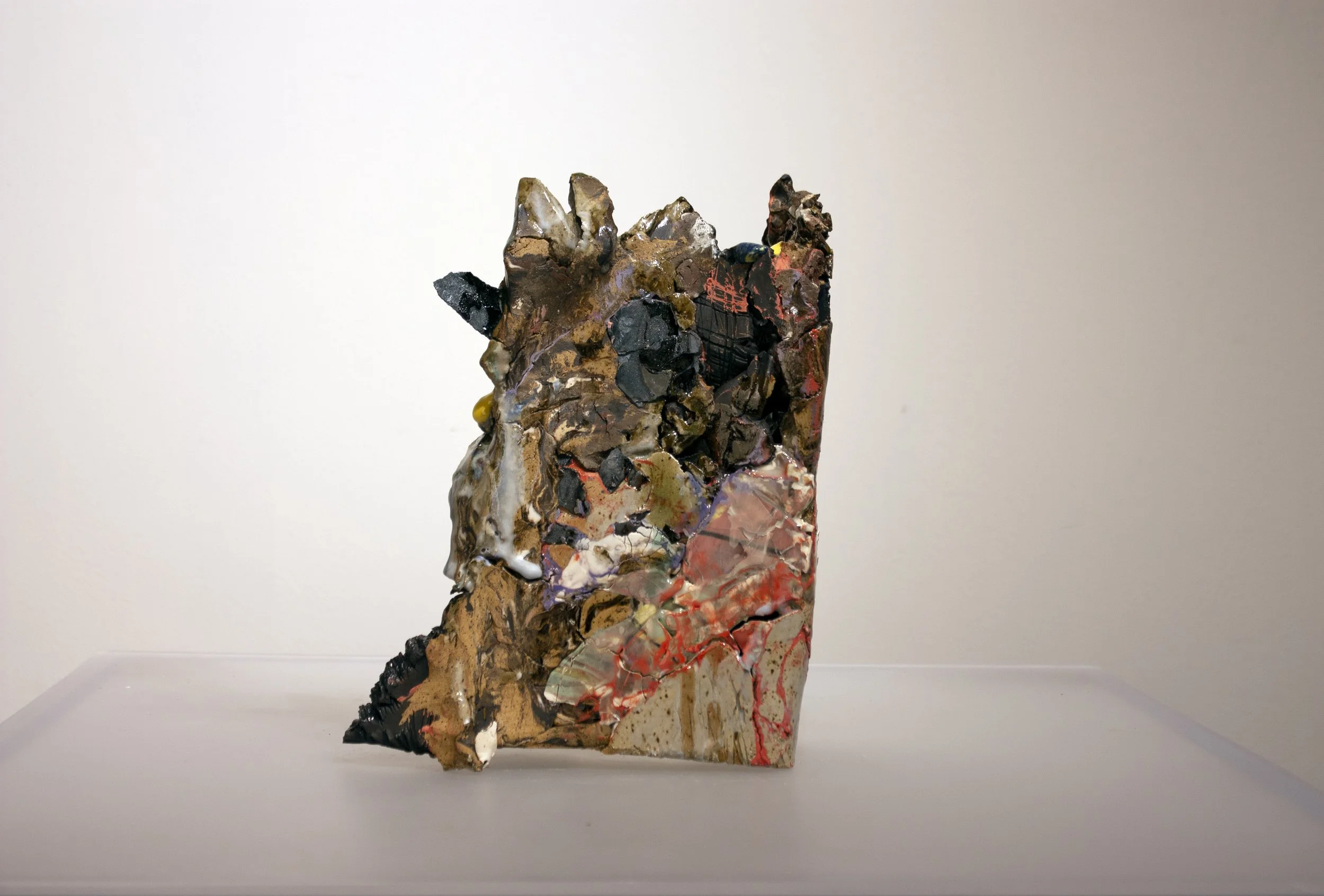 "Angry Strata" 2021-22. Press-molded recycled stoneware, steel shards, gravel, glaze, and found bisque.
