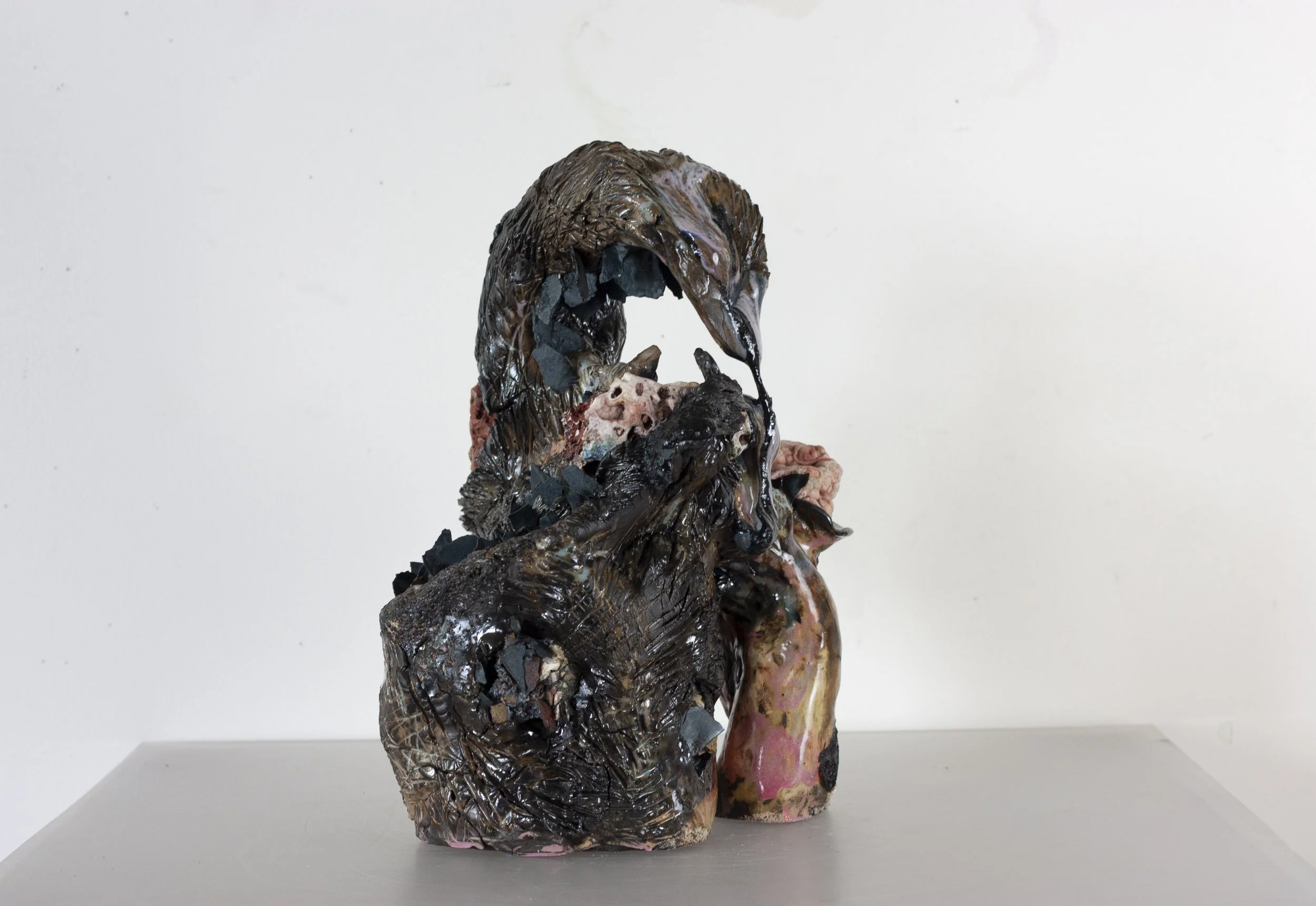 "Scorpion Mother," 2023. Serrated black stoneware, underglaze, crushed steel glaze, melted steel chips, Huzzah Valley found rocks, studio detritus, glaze.