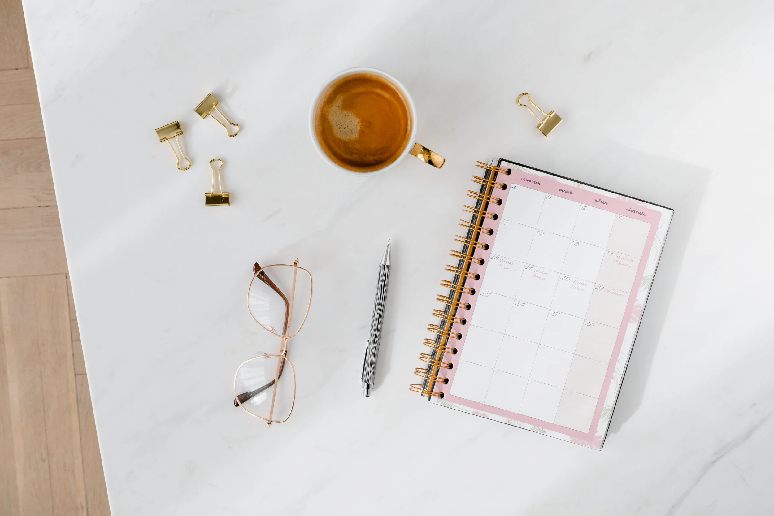 kaboompics_Top view of a marble desk with coffee, notebooks and pen.jpg