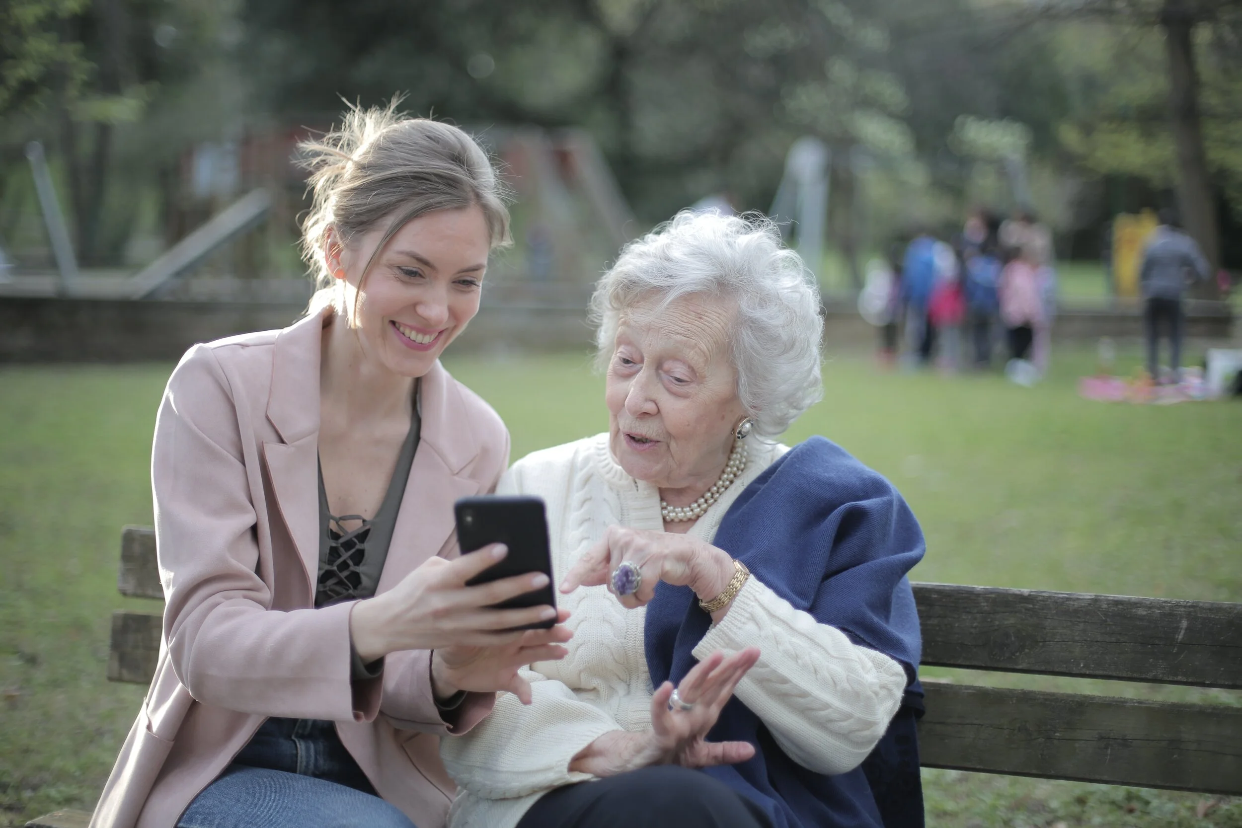 cheerful-senior-mother-and-adult-daughter-using-smartphone-3791664.jpg