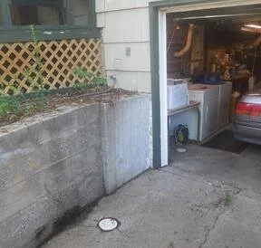 Driveway drain discharges into sanitary drain