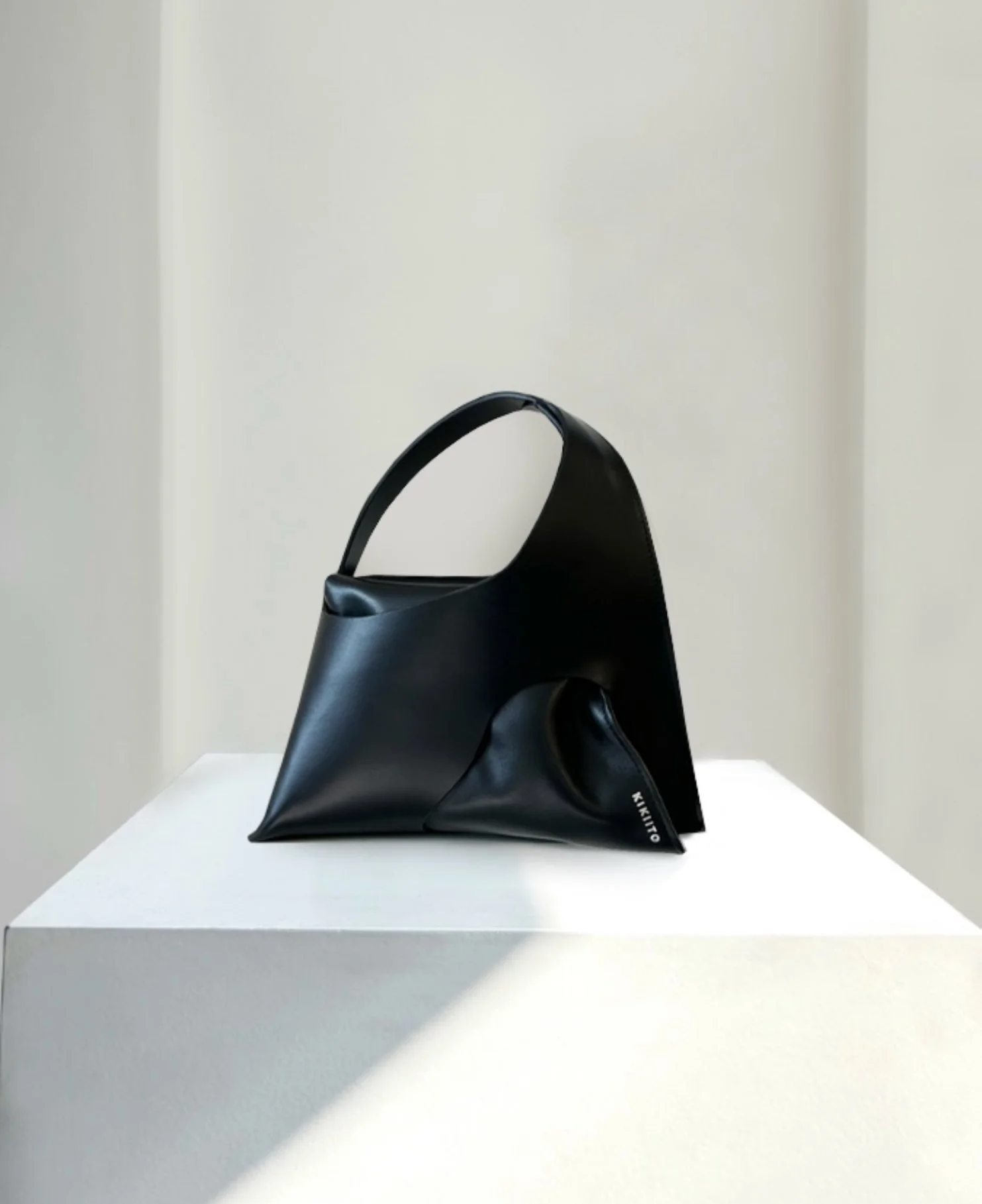 kiki-ito-house-of-ito-luxury-handbag-accessories-hoshi-small-black-leather-bag-handbag-handcrafted-in-London-sustainable-brand-minimal-style-leather-handbags-accessories-unique-contemporary-minimal-avantgarde.jpg