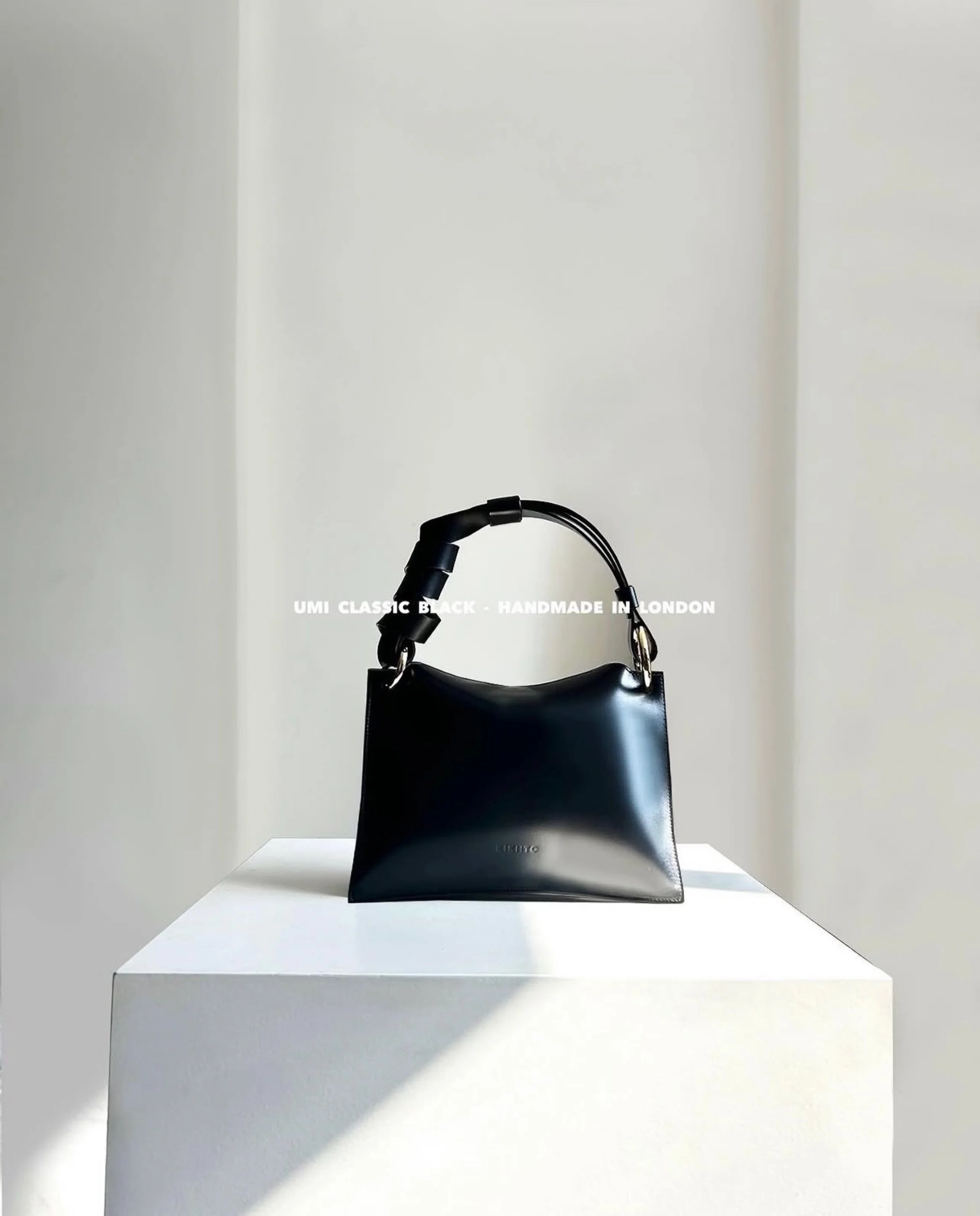 kikiito-umi-classic-black-leather-handbag.jpg