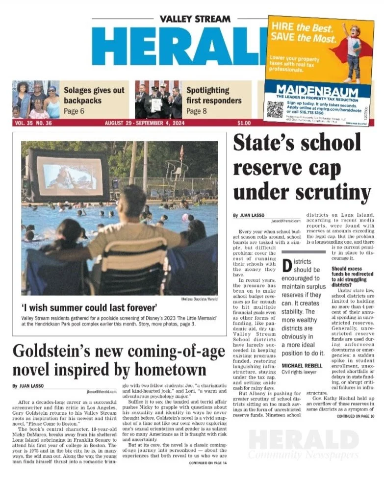 A newspaper page titled 'Valley Stream Herald' featuring articles about local events, including a poolside movie screening, a new novel inspired by hometown, and a school reserve cap controversy. The page contains a photograph of people watching a movie outdoors at a pool.