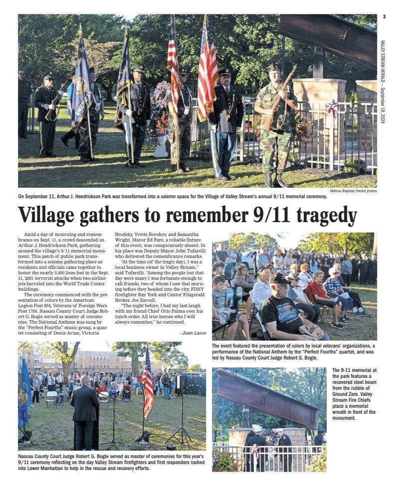 Ceremonial flags and a soldier laying a wreath at a memorial during a 9/11 remembrance event in a park.