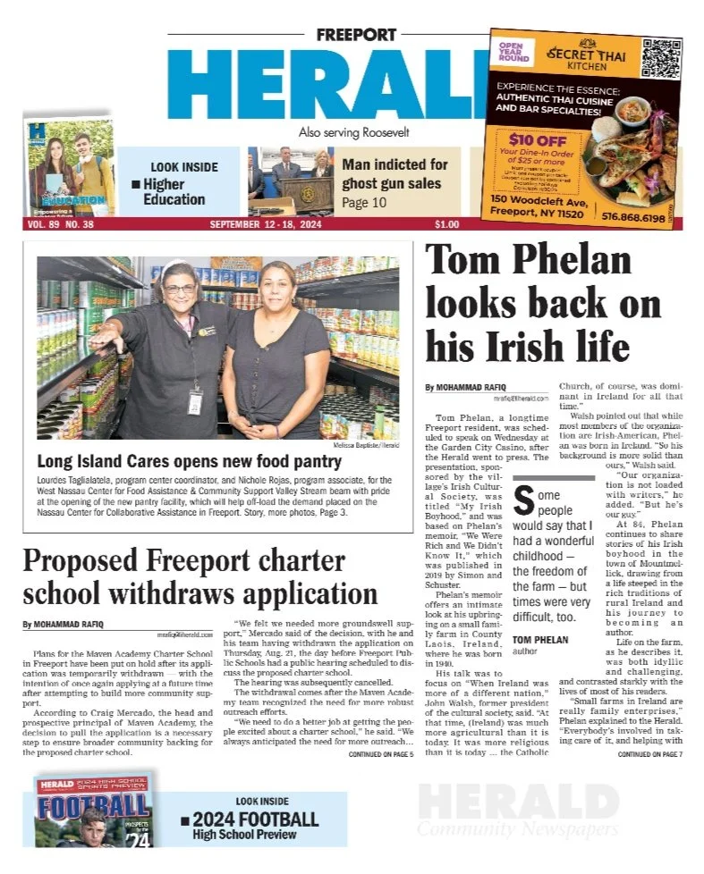 Front page of the Herald newspaper featuring headlines about a new food pantry opening, Tom Phelan reflecting on his Irish life, and a proposed Freeport school charter withdrawal. Includes advertisements and a photograph of two women at a grocery store.