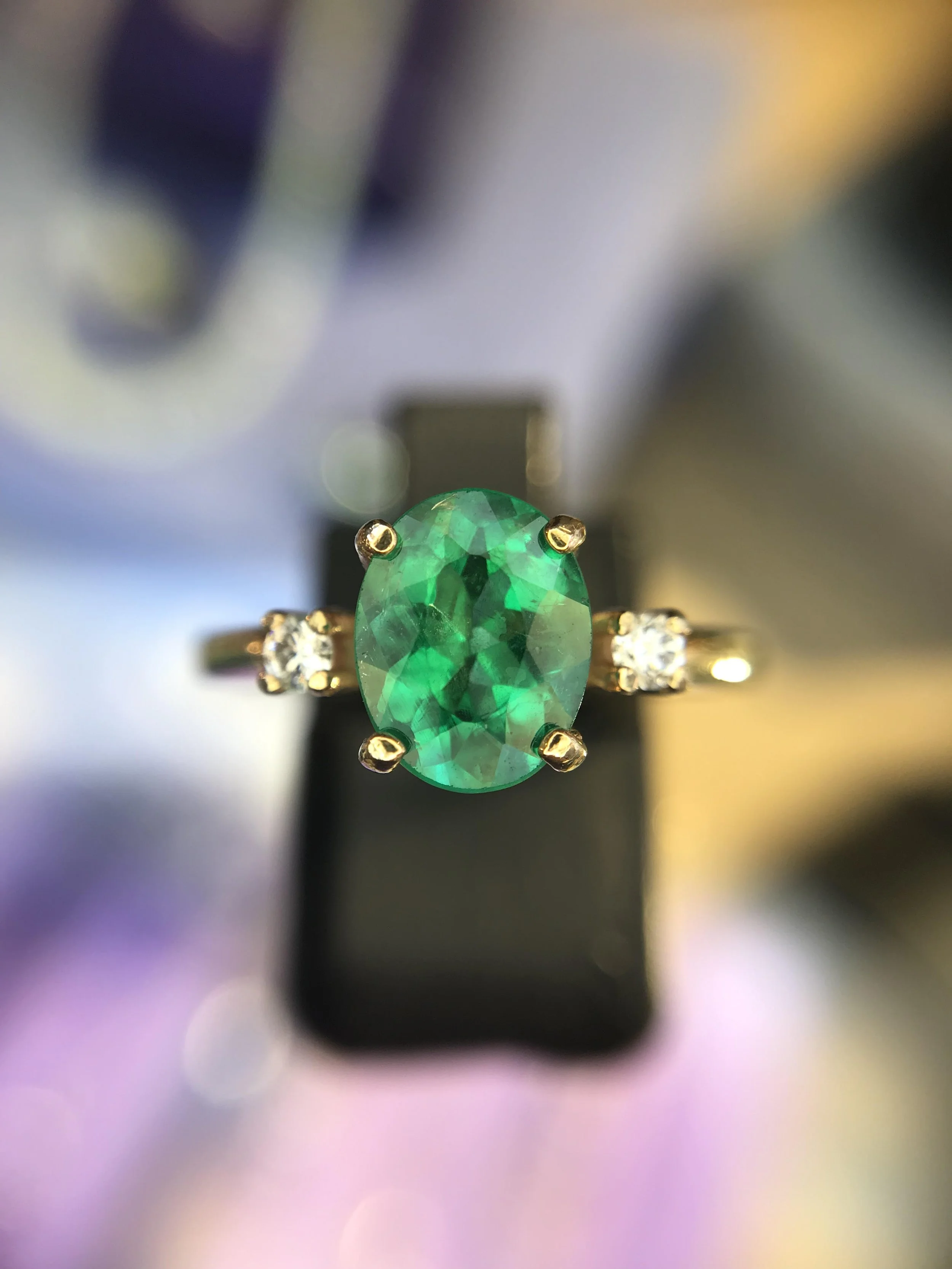 Gorgeous Emerald Ring set in 14K Yellow Gold, checkerboard cut with 2 diamond accents