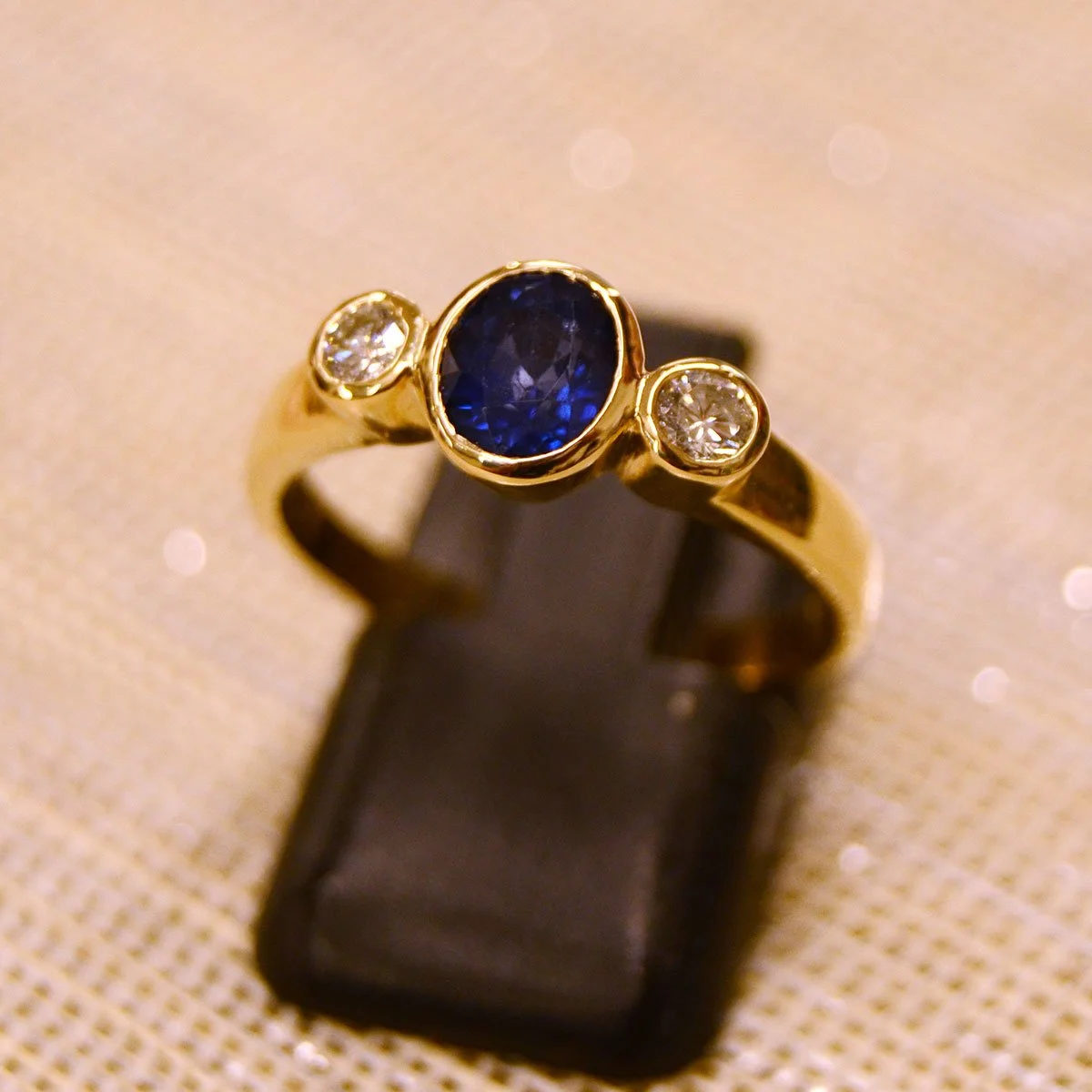 Natural Oval Sapphire & Diamond Three-Stone Bezel Ring