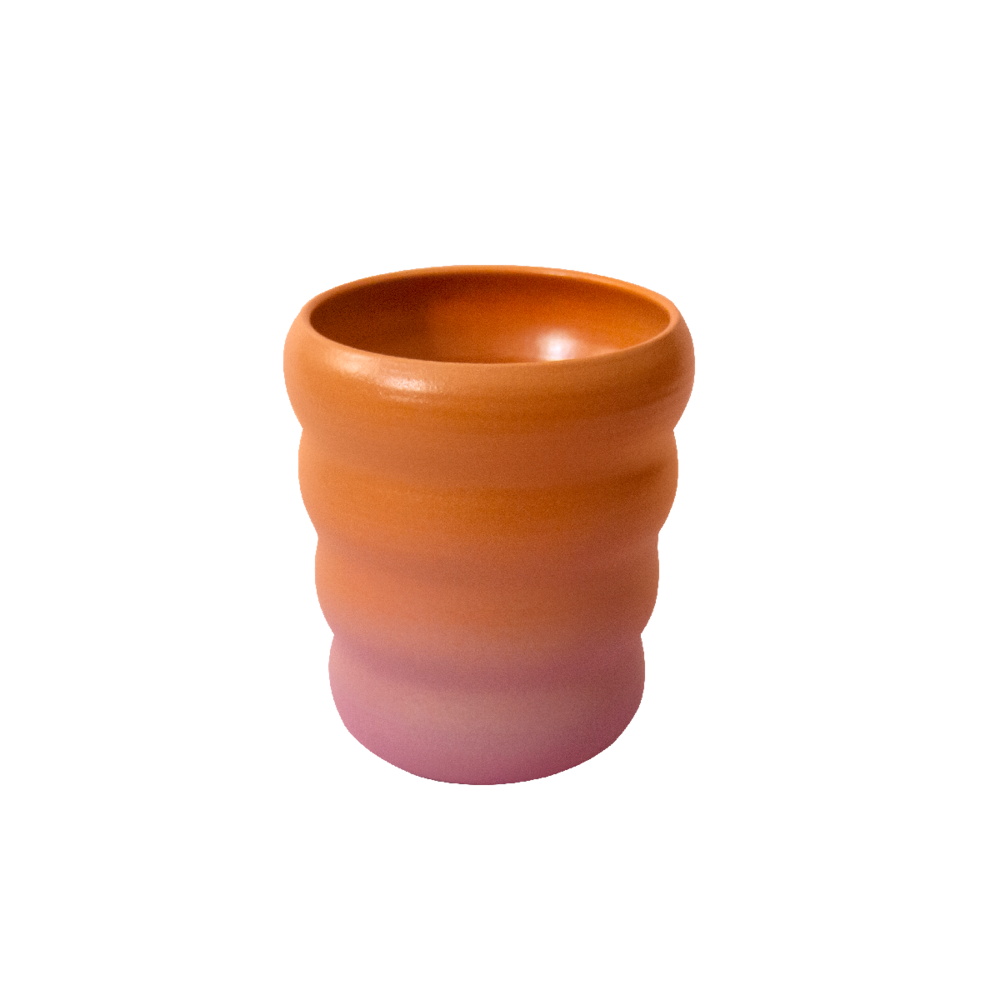Orange and pink gradient glaze cup with wavy design