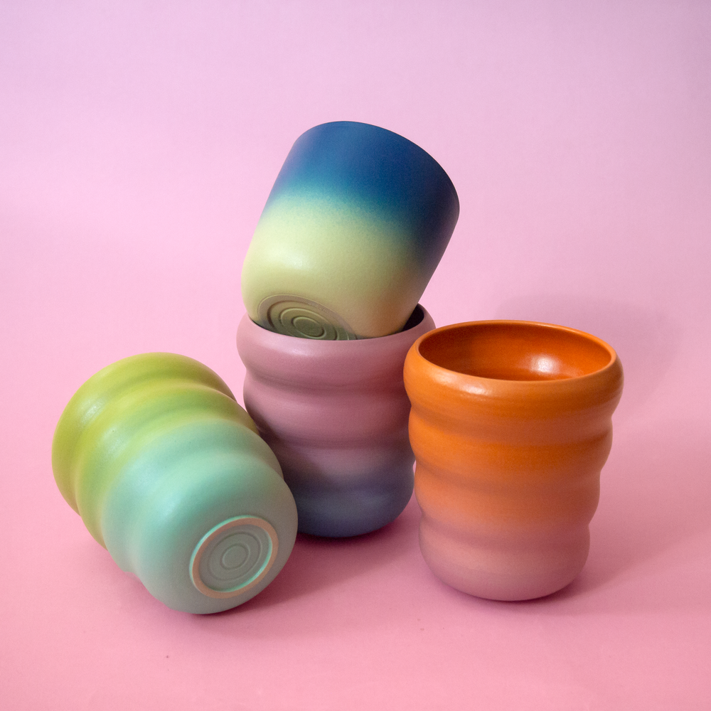 Collection of handmade cups by ceramicist Marilyne Blais