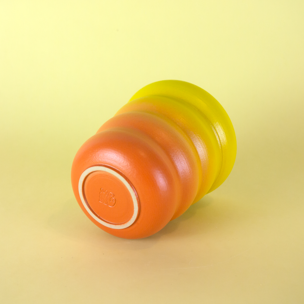 ceramic cup by Marilyne Blais laying on it's side