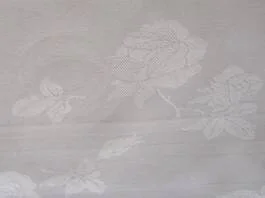 Double DamaskA top-shelf 100% pure cotton product.This heavy weight Damask with its traditional woven Rose pattern offers a long wearing fabric that is at home in the best of restaurants.