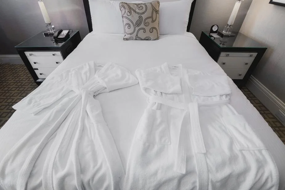 Hotel bed with robes.jpg
