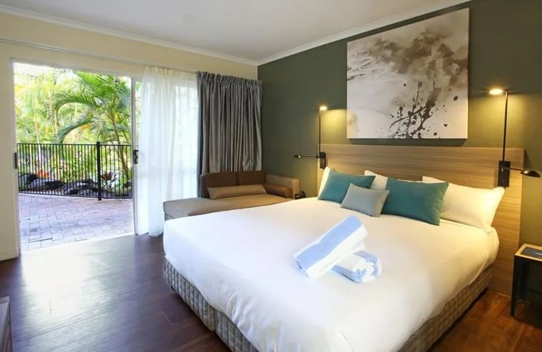 sky blue pool towels on bed.JPG