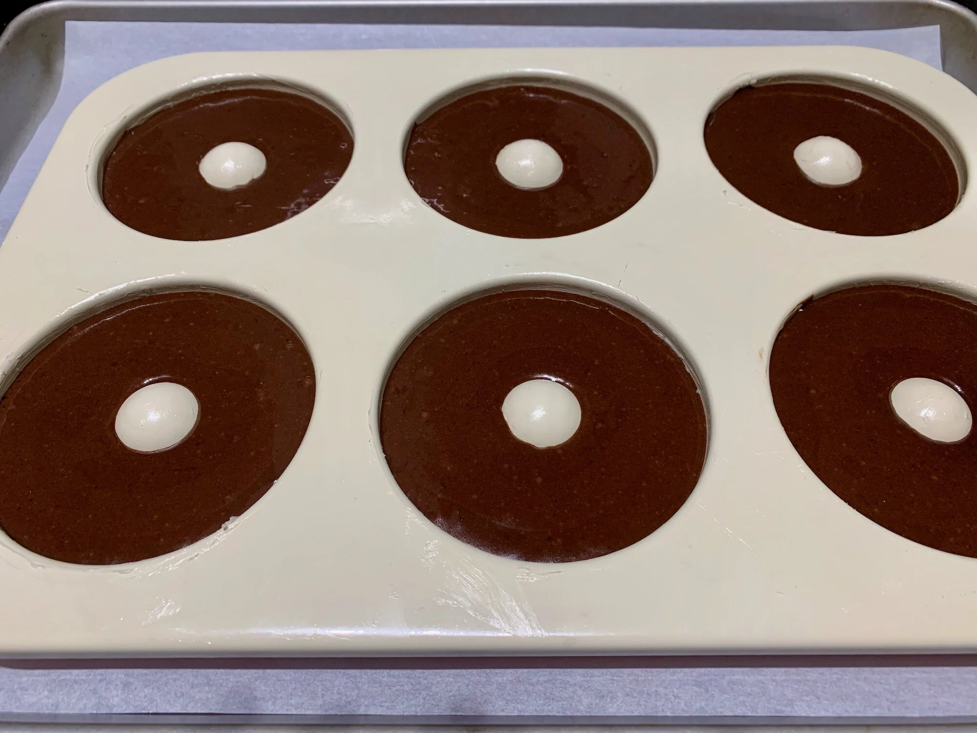 This is how filled my doughnut pans look before baking. You could fill them with slightly less batter and you’ll end up with smaller doughnuts but more of them.