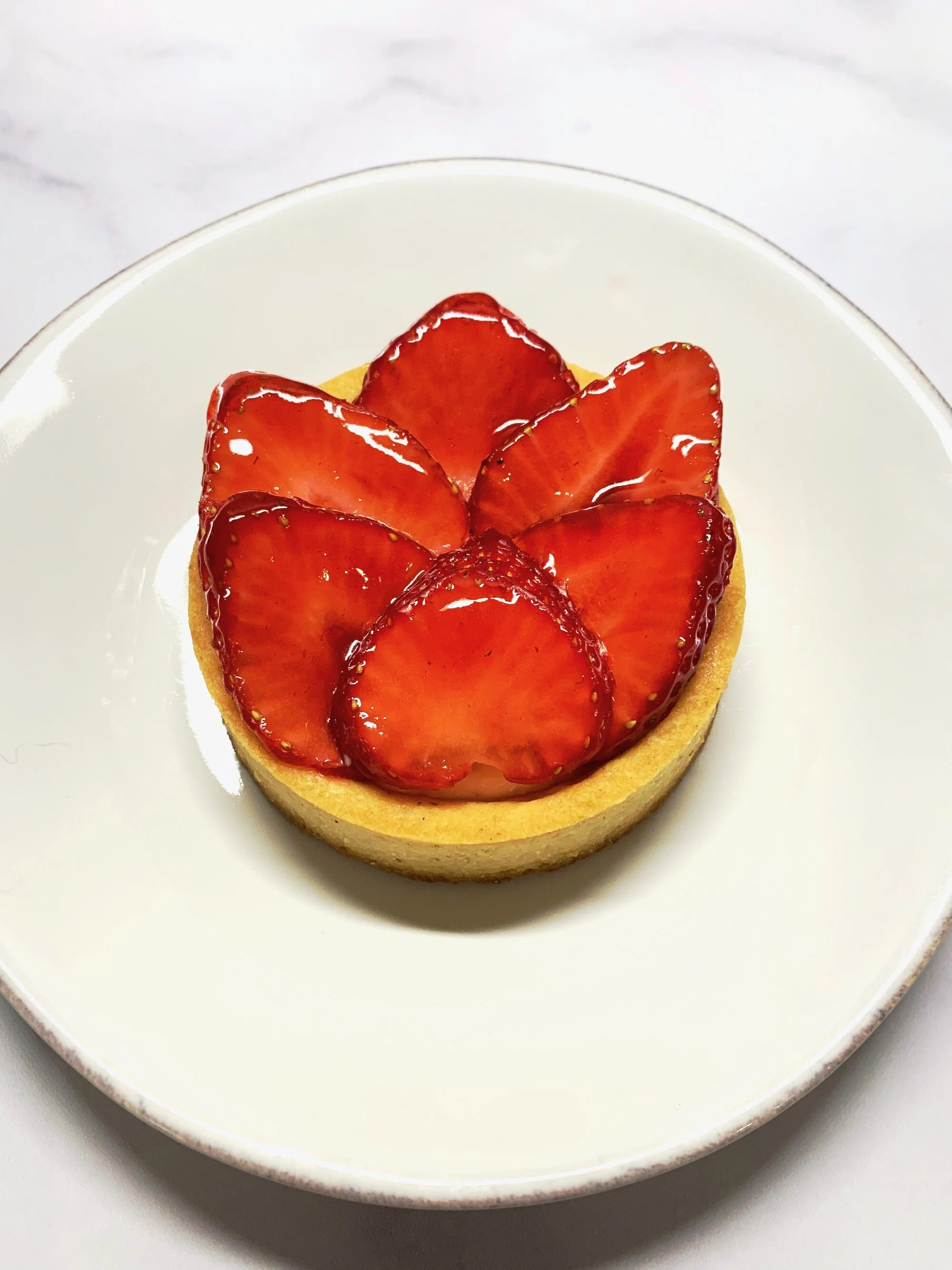 Glazed strawberries before topping with basil whipped cream. So beautiful.