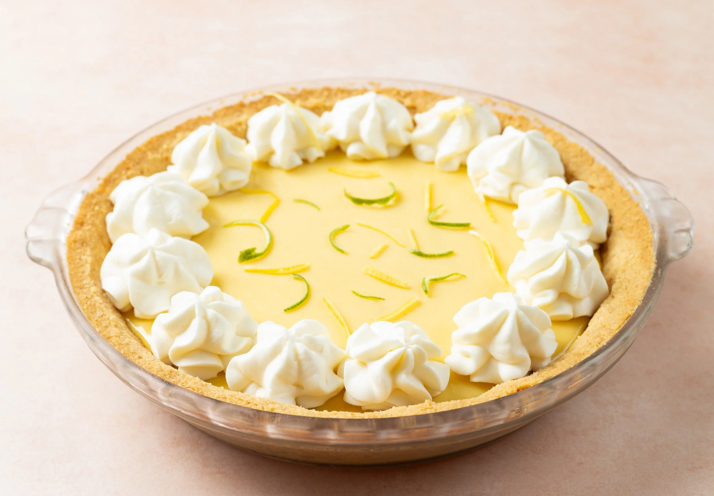 Photo of a pie with lemon/lime filling and whipped cream on top