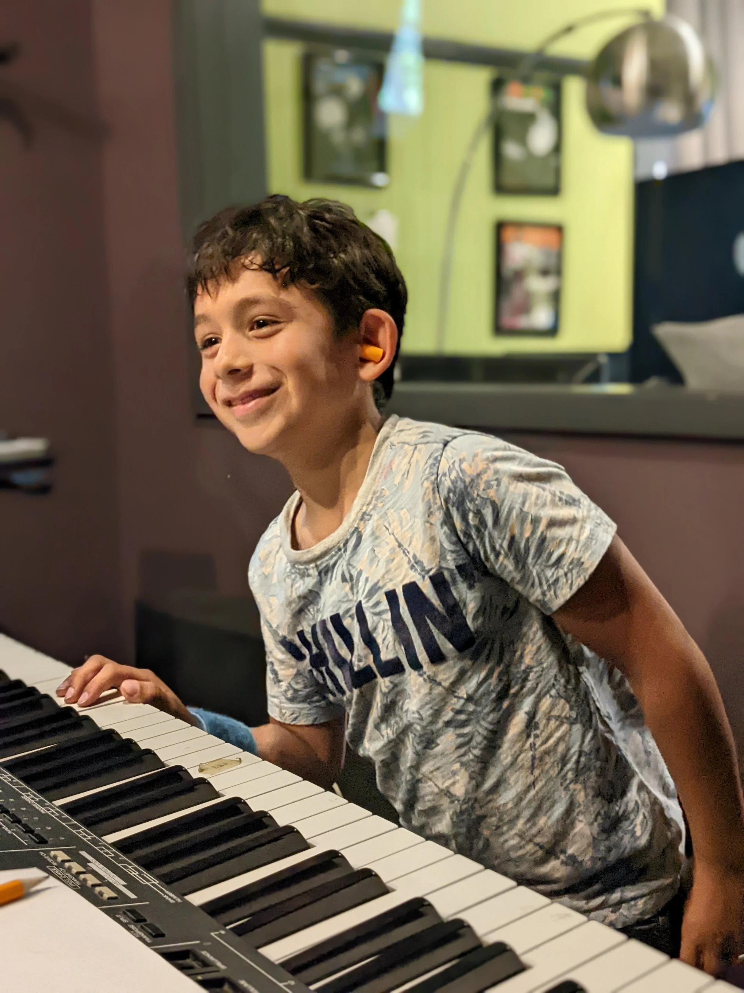 Kid smiling keys.jpg