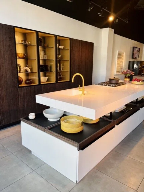 A kitchen with open storage underneath the countertop at West Hollywood Design District.