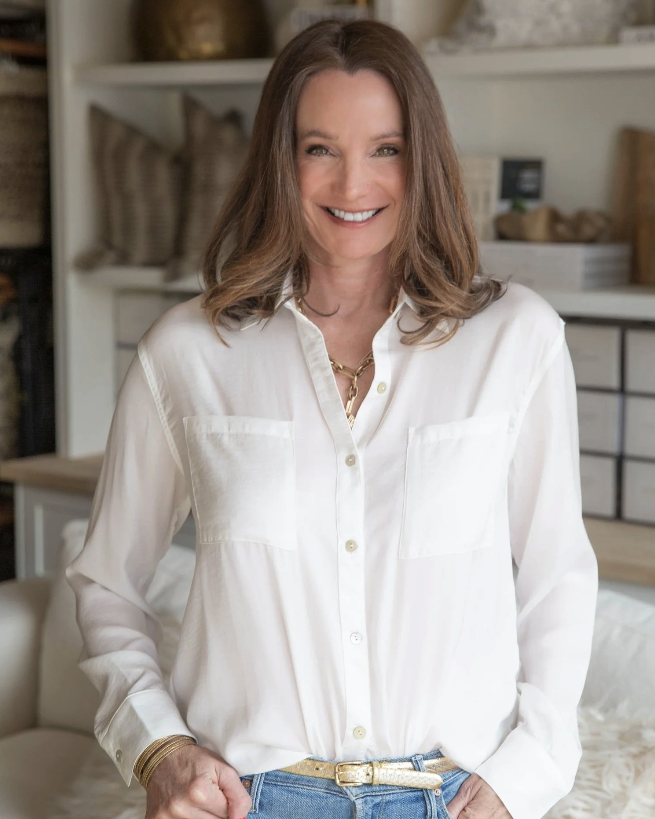 Anne Mastalir, founder of Design Bar Interiors Bend and Skyhouse Collective, laughing and smiling at the camera