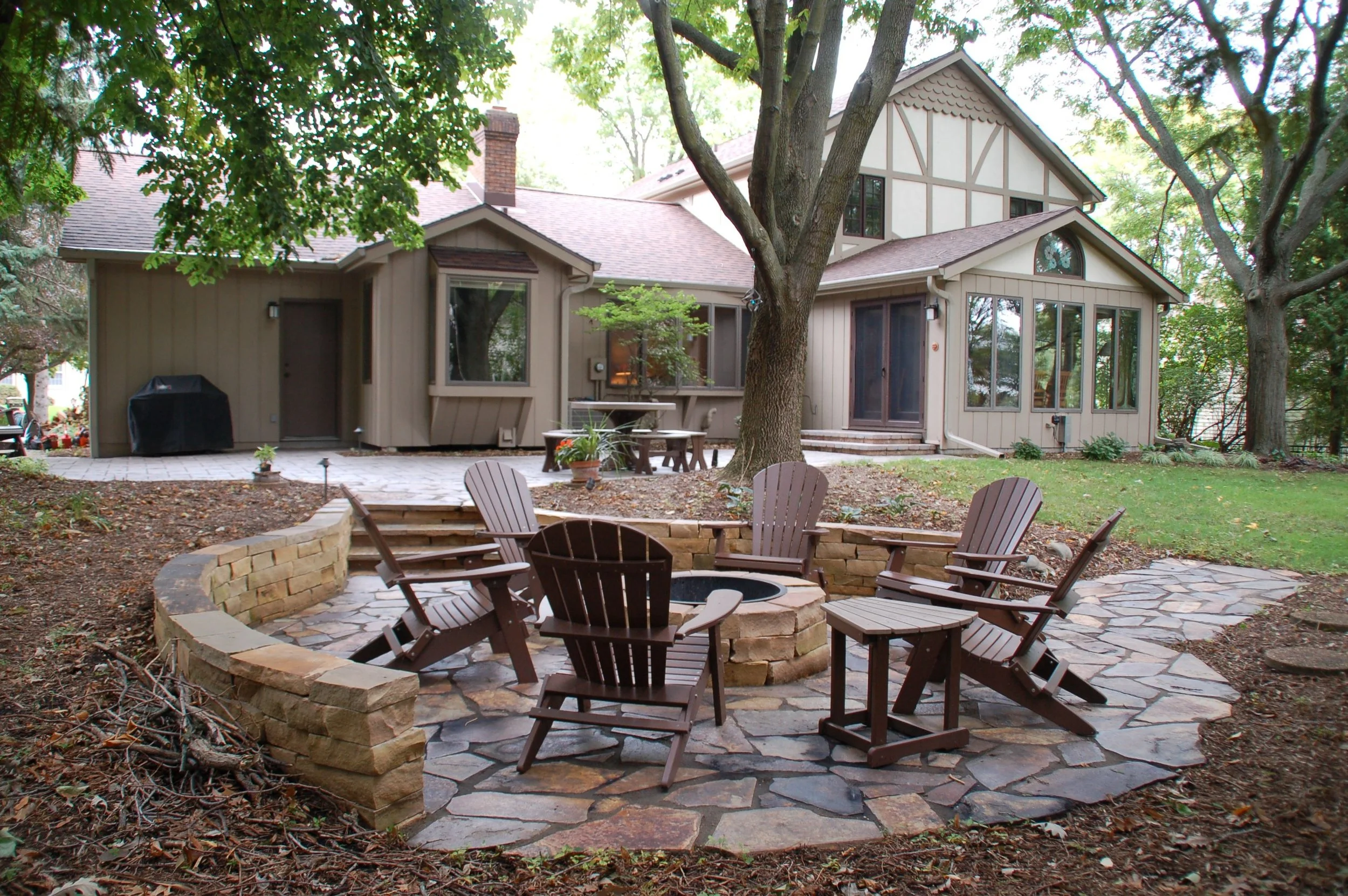 Outdoor Fireplace vs. Fire Pit: A Guide to Choosing the Right Fire Feature for Your Madison, WI, Landscape