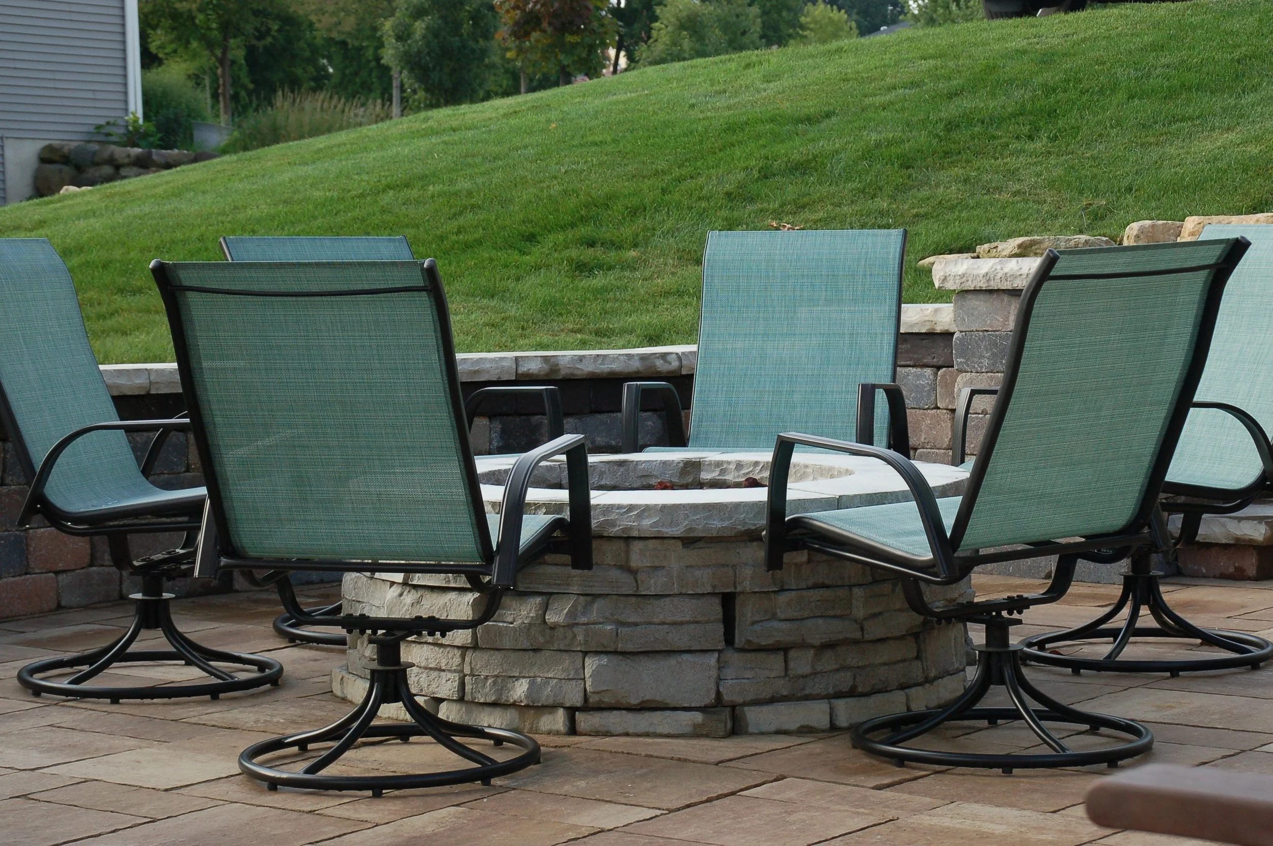 Why Landscaping Companies Near Me Recommend Including a Fire Pit in a Landscape Plan in the Madison, WI Area
