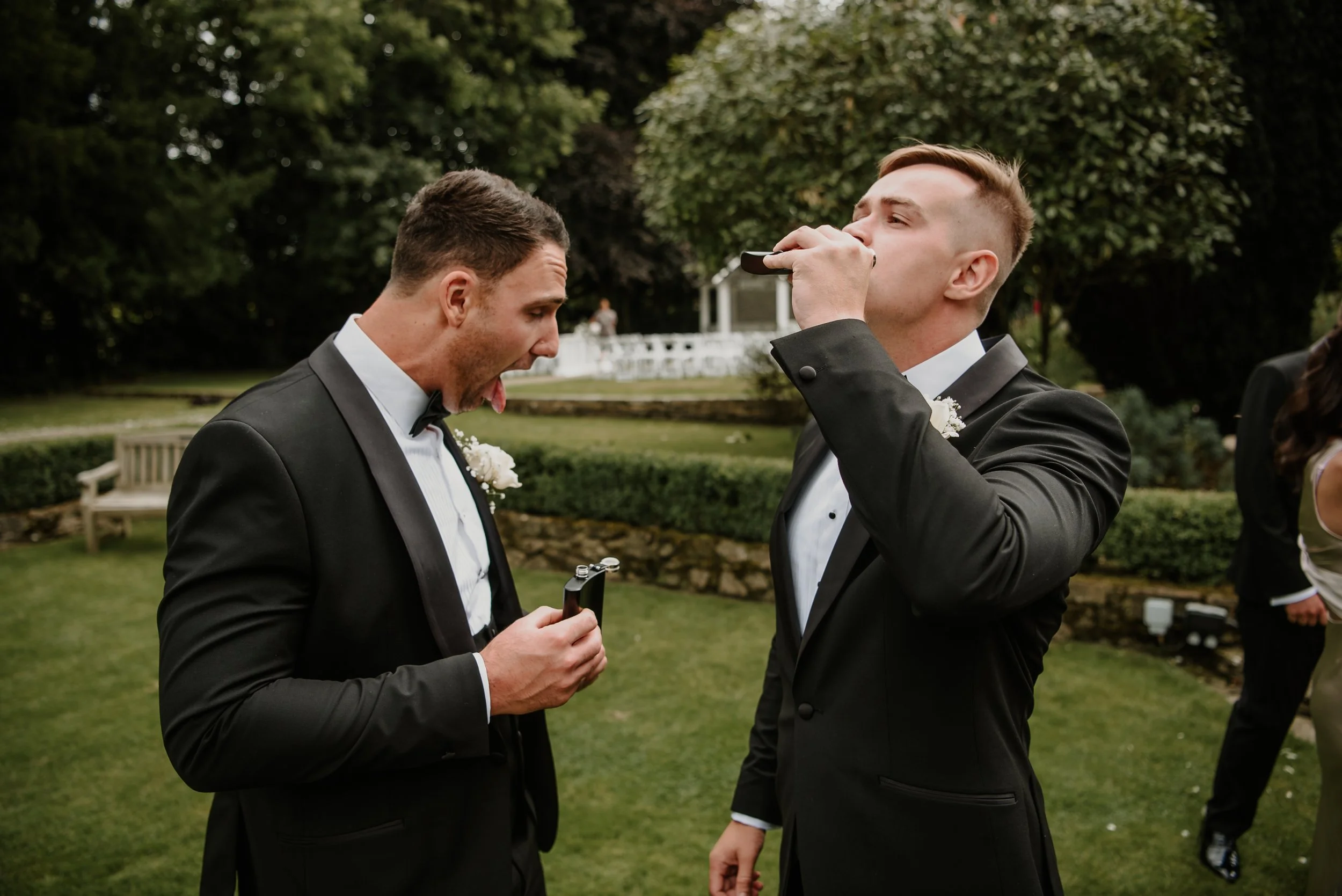groomsmen reacting to drinking from a hipflask at Hayne House.