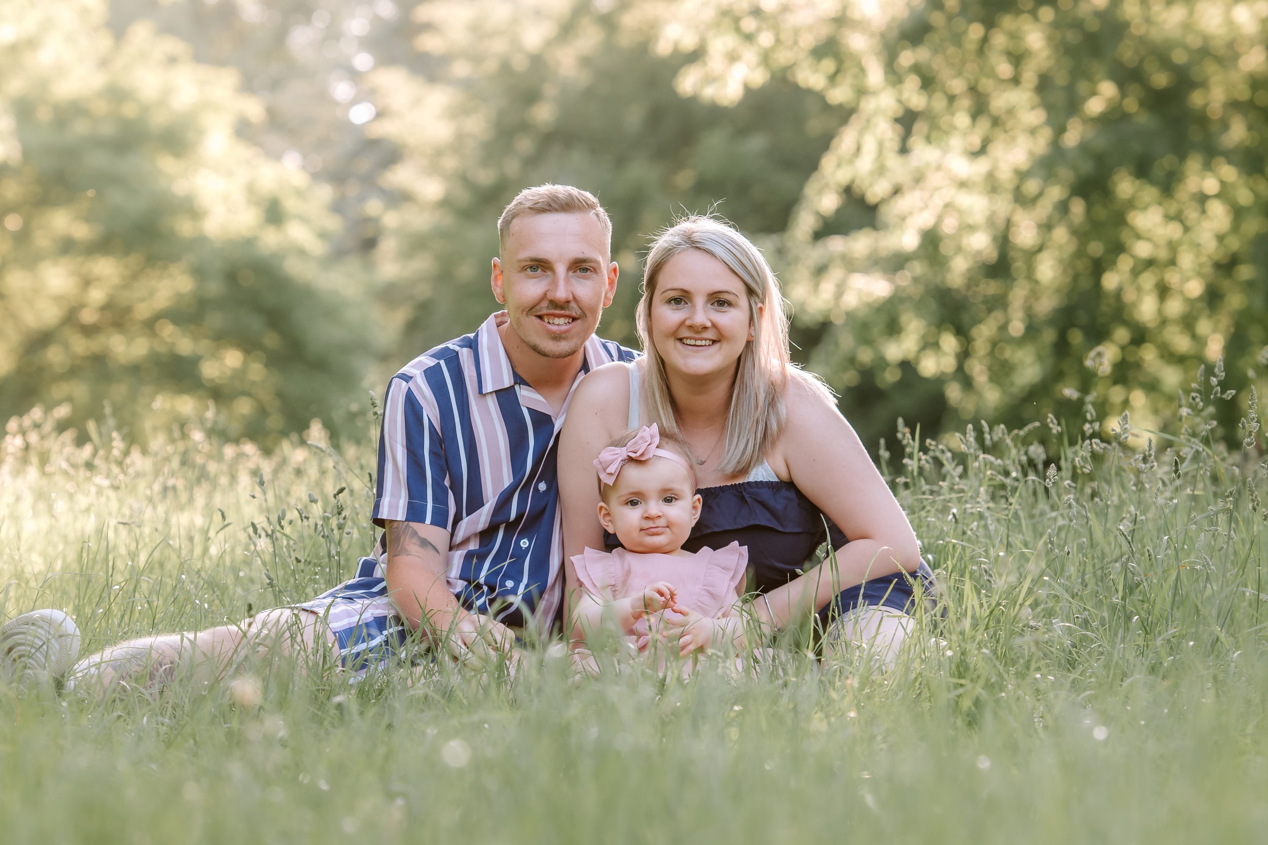 family portrait during sunset in long grass