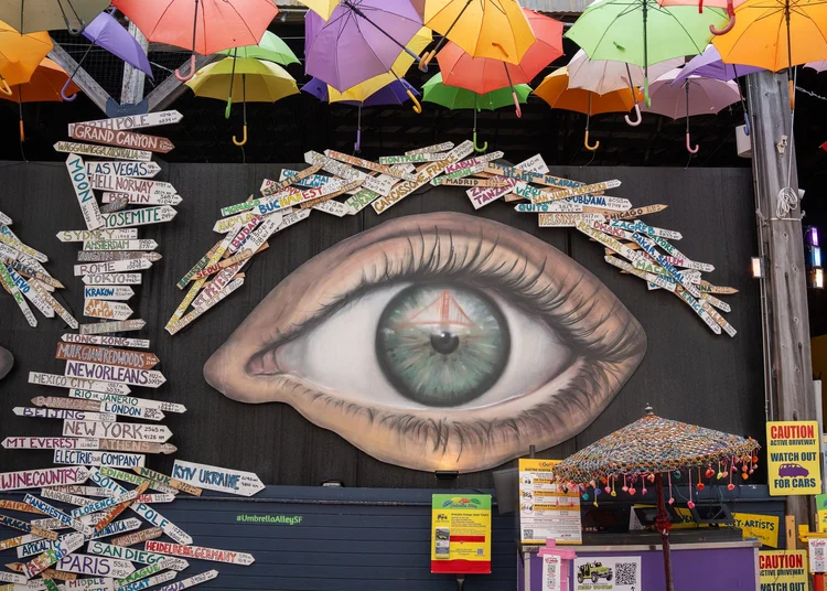 Colorful mural and hanging umbrellas