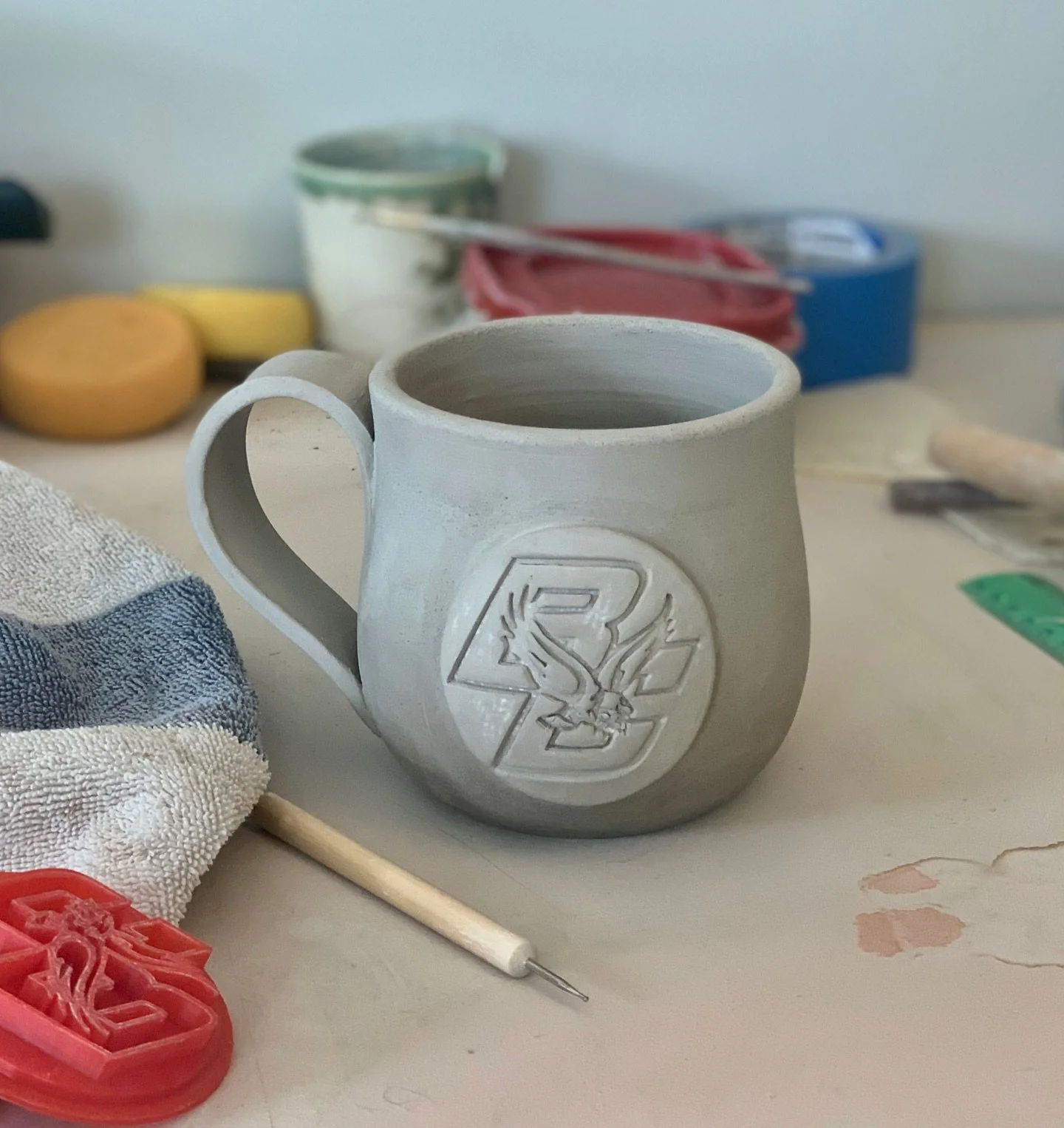 Work in progress! 🦅☕

Making my sister a Boston College mug because if she works at BC, her coffee should too. Stay tuned for the glow-up. 🌟

#BCEagles #WIP #PotteryInProgress #SisterProject