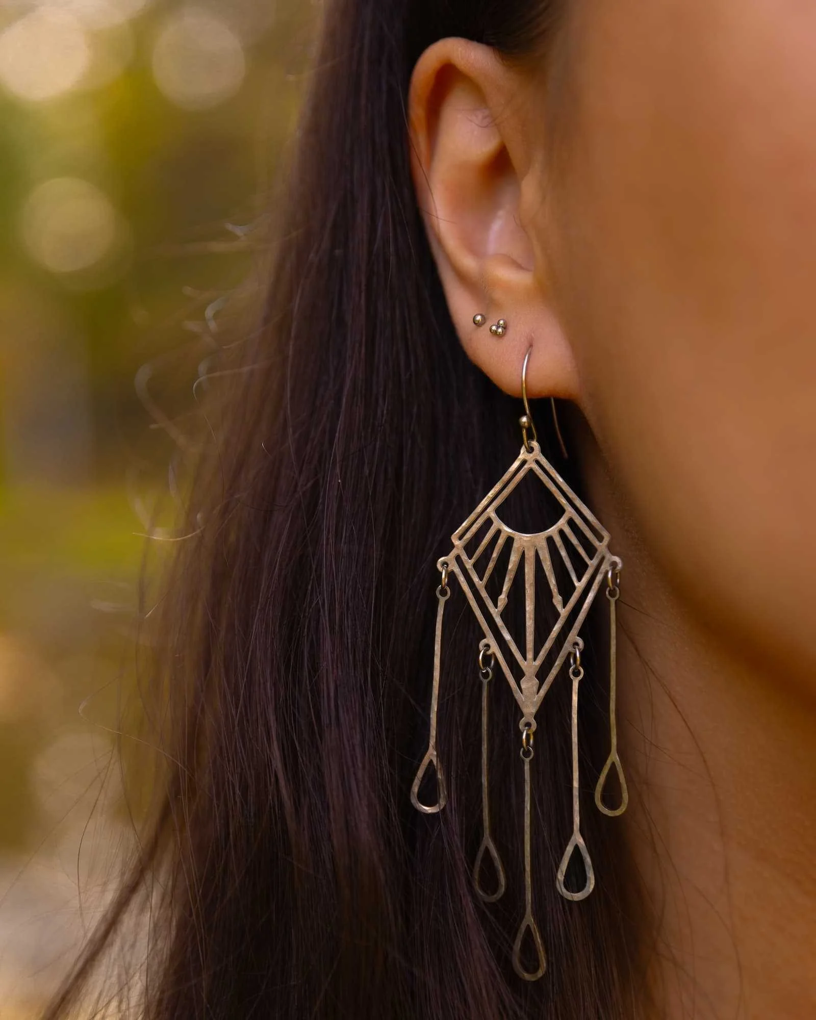 sun-admist-rain-sustainably-eco-ethically-handmade-silver-celestial-geometric-chandelier-earrings-closeup.jpg