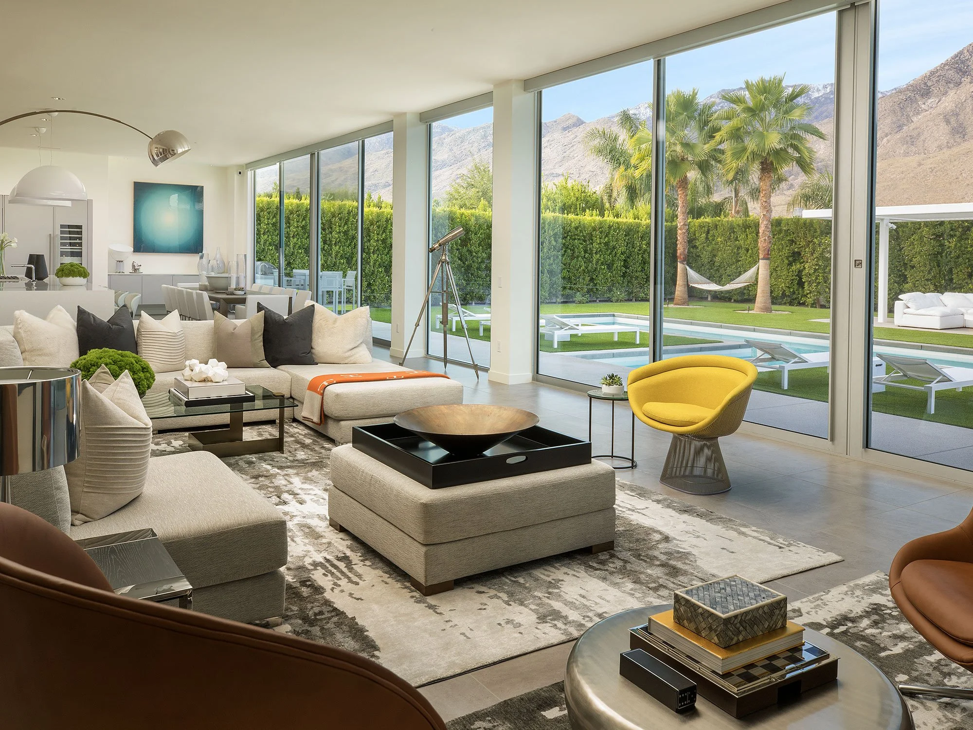 Modern Palm Springs living room with floor-to-ceiling windows and mountain views
