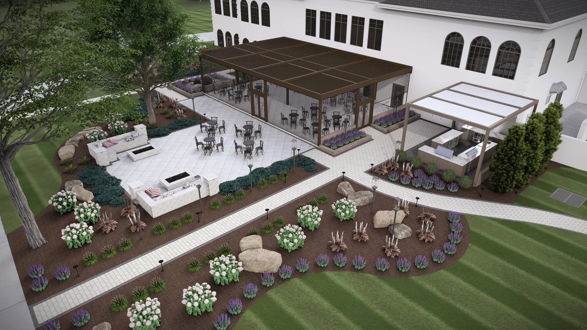 Aerial view of an outdoor restaurant patio with tables and chairs, landscaped garden beds, a shaded lounge area with white furniture, and a building with large windows and a retractable awning.