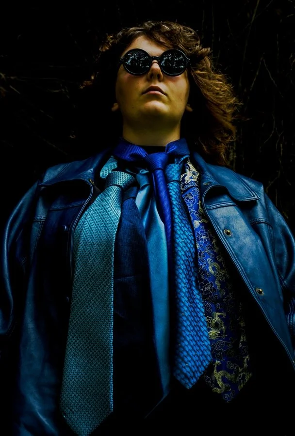 Girl with six blue ties | Monika Coles