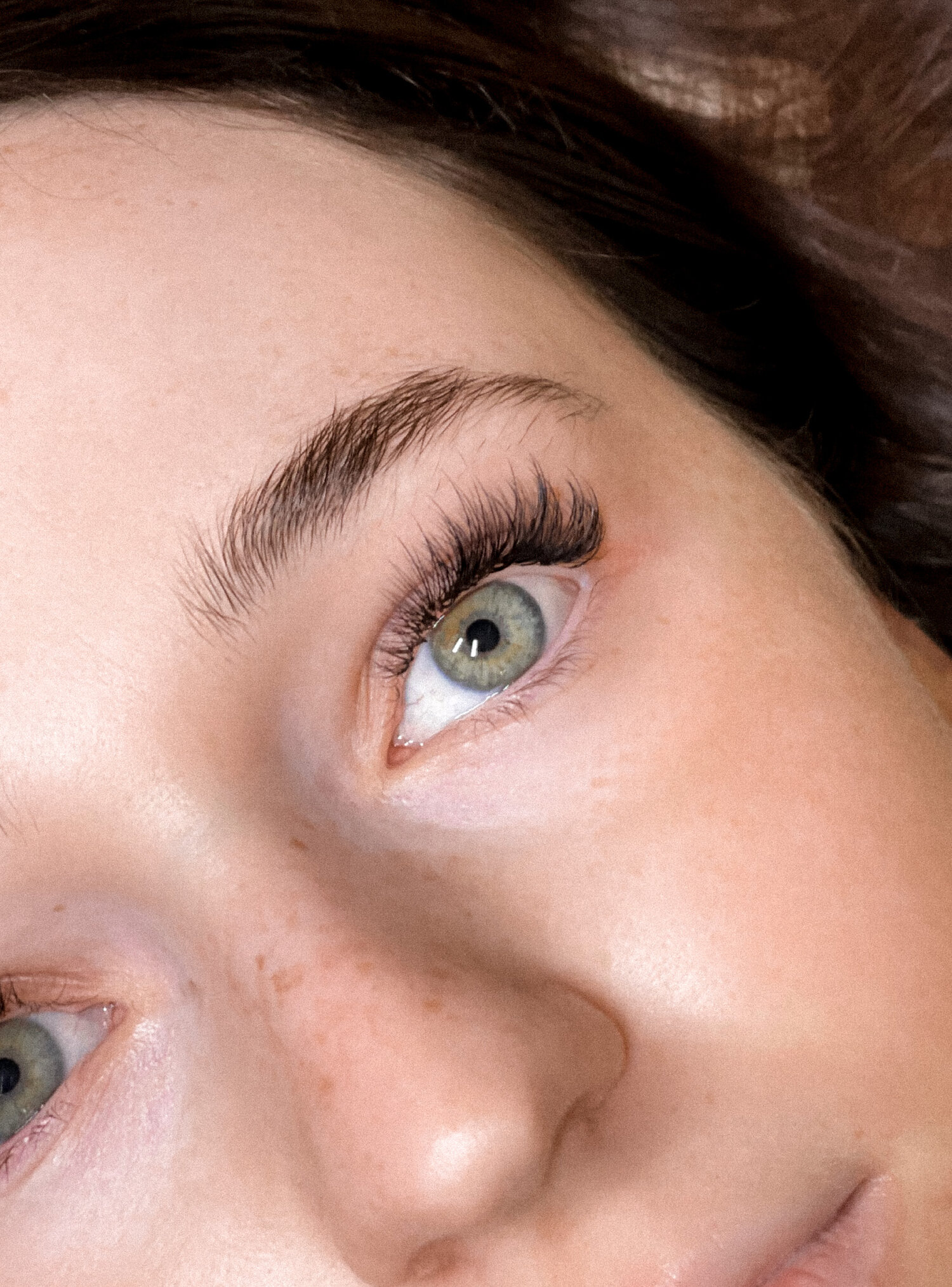 Light, wispy hybrid lashes. A mix of classic and volume extensions