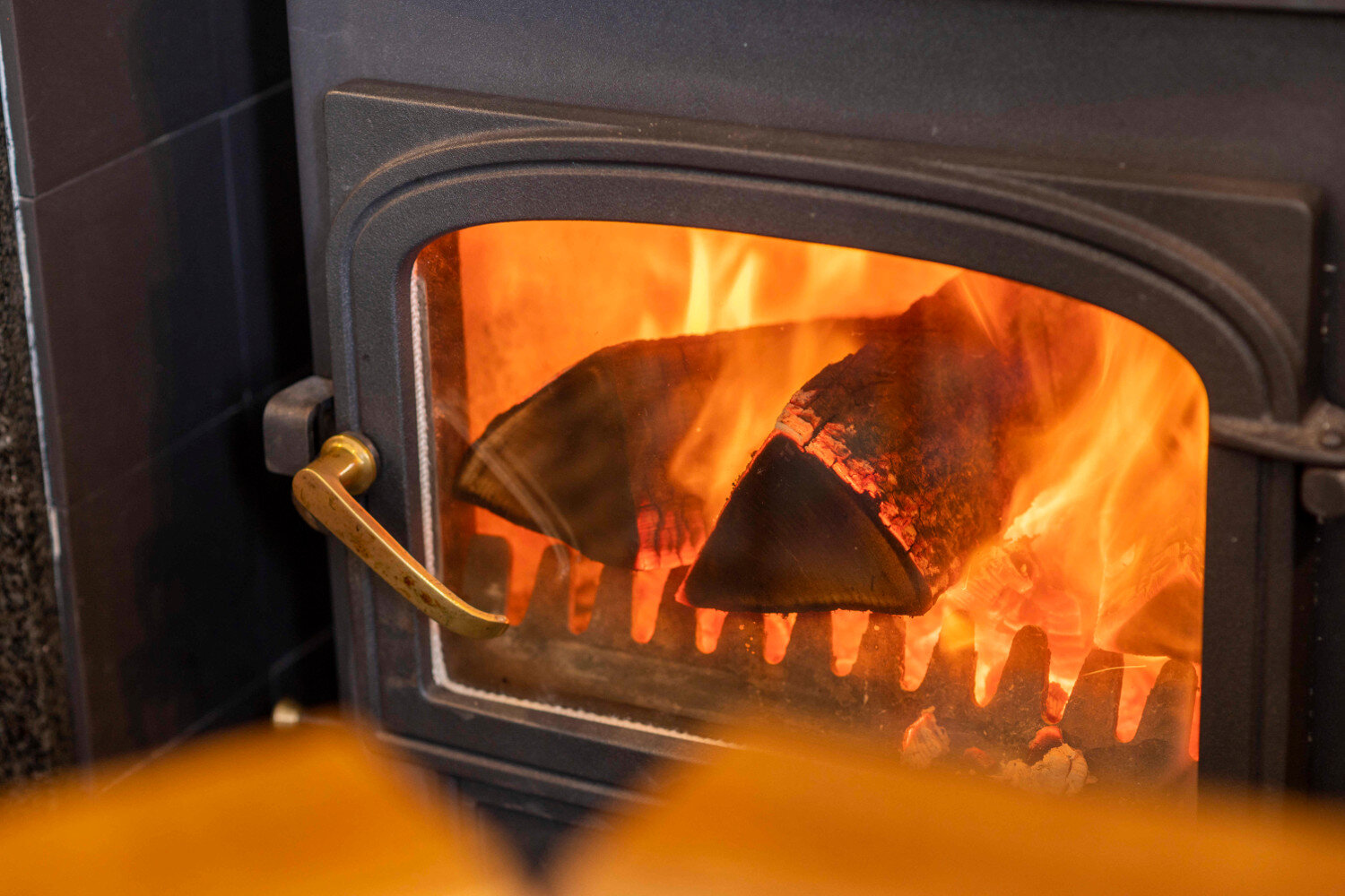 Wood burning stove in self-catering accommodation at Saplinbrae Hotel & Lodges.JPG