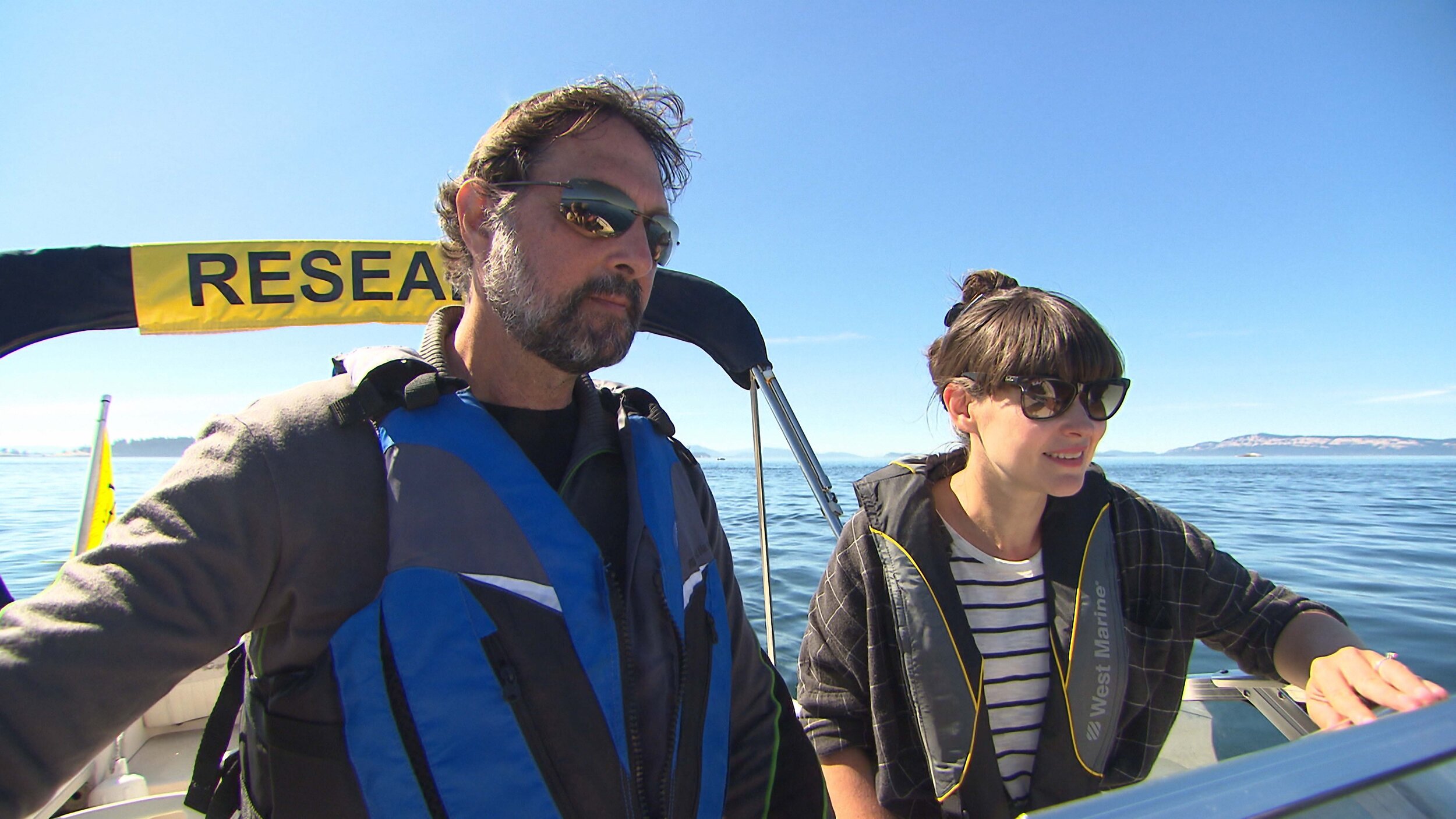Dr. Jennifer Gardy and Dr. Sam Wasser chasing Orca poo