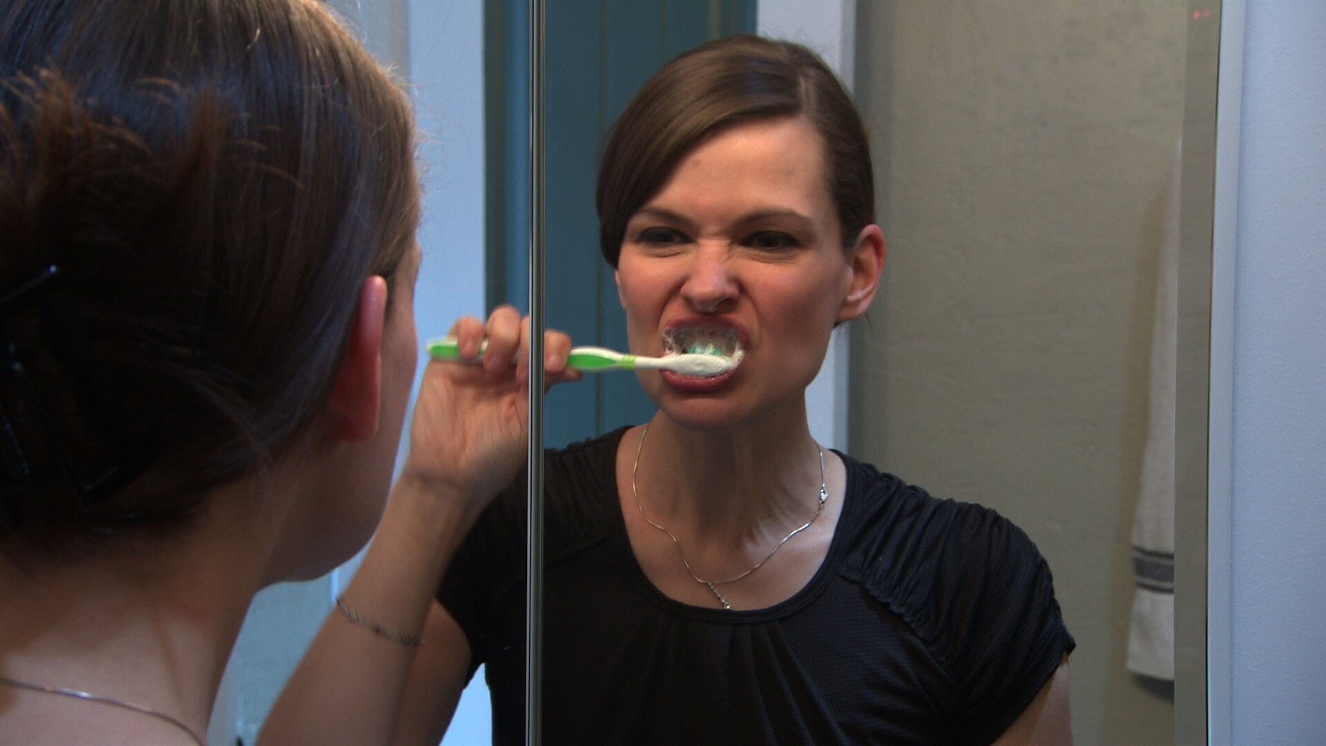 Dr. Jennifer Gardy brushing teeth