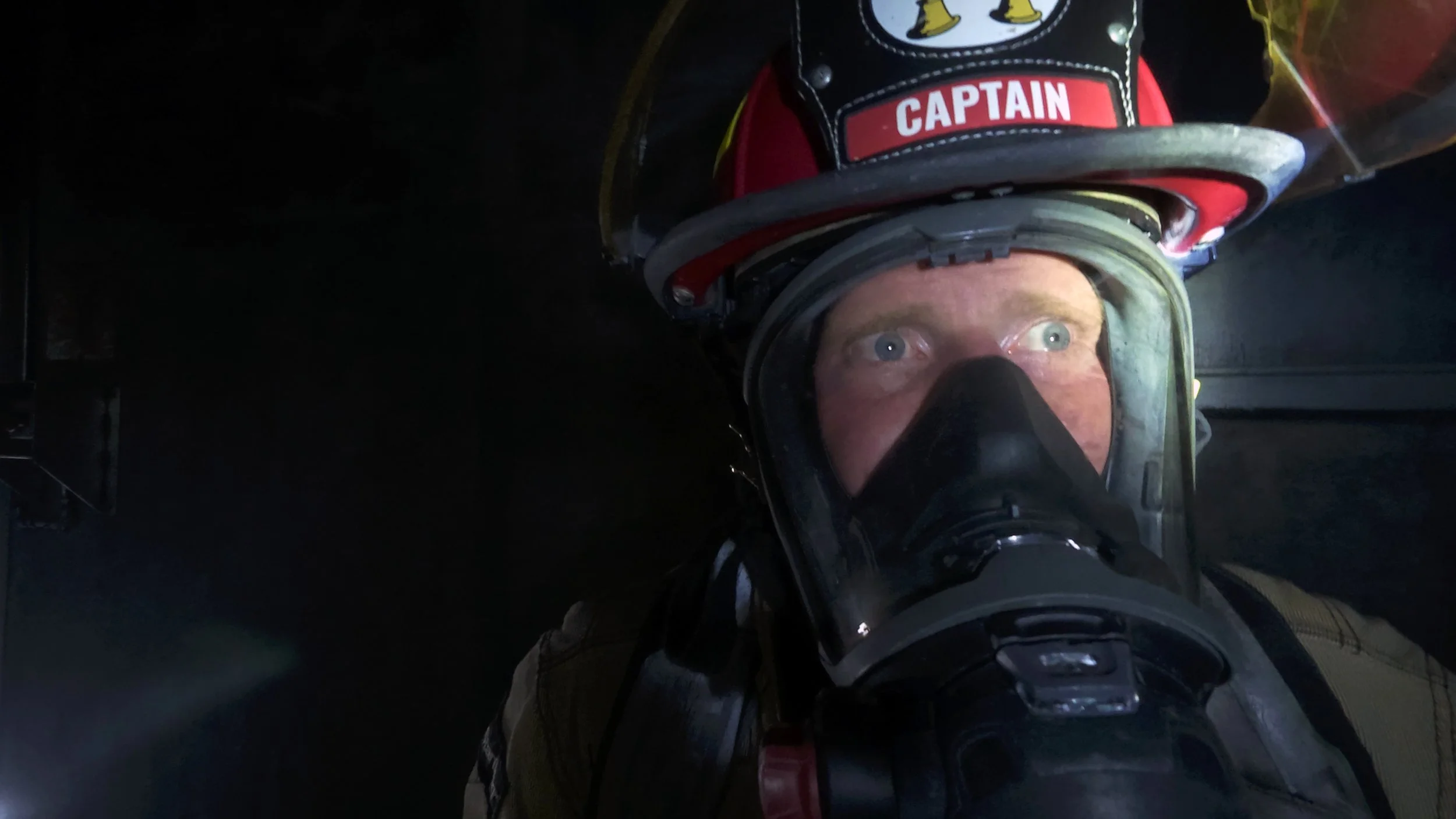 Captain John Robbins of the Richmond Hill Fire Department inside a burning building training to make considered decisions at intuitive speeds