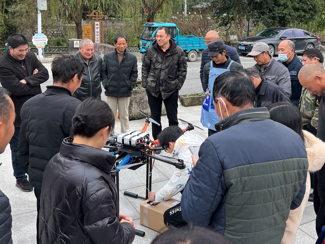 A crowd gathers at the local logistics center as the A2Z team prepares to make some residential deliveries.