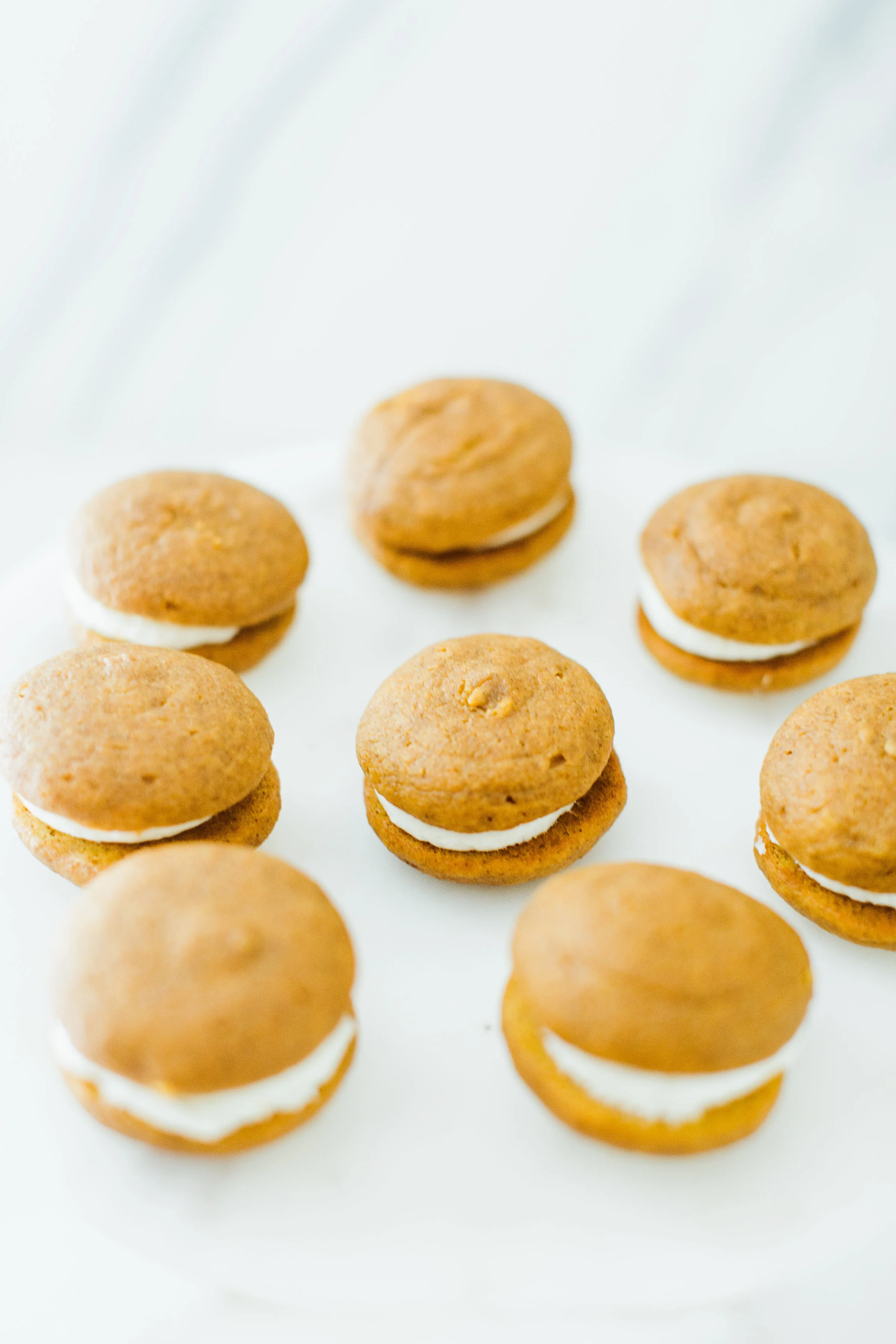 Pumpkin Whoopie Pies with Orange Ginger Cream Cheese Frosting