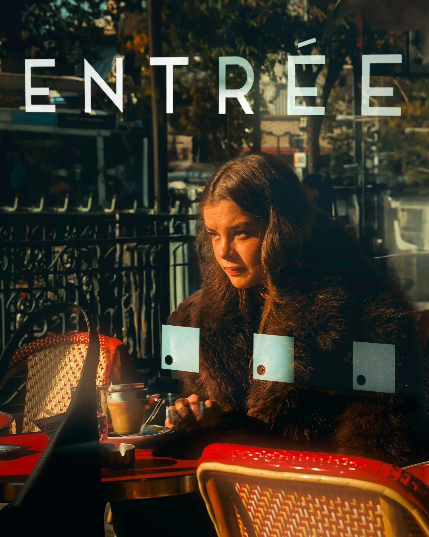 Paris by day begins here: at the door, at the light, at a table for one.

Taken during my last time in Paris &mdash; November 2024.
Let me know if you have a favorite