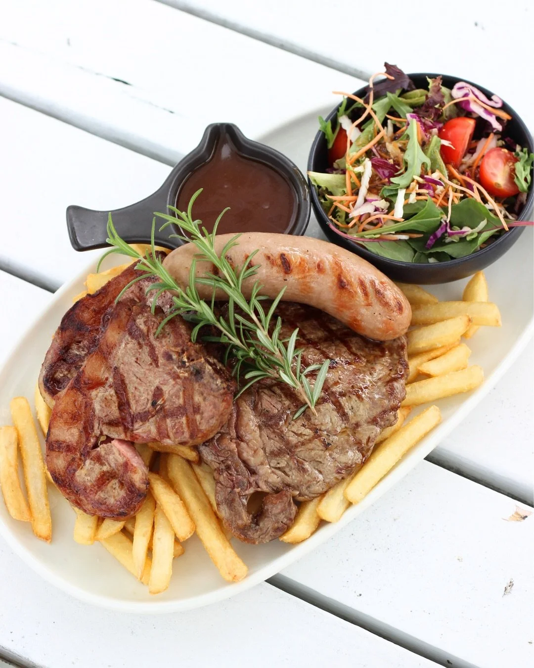 Available this long weekend only!🤤

Mixed grill with rib fillet steak, lamb loin chop and a pork sausage or our Lamb Loin chops, both served with chips, salad &amp; gravy. Members pricing applies so swipe your card for $$ off!

So to answer your que