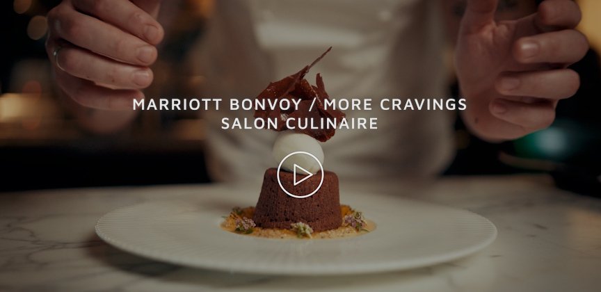A chef garnishing a dessert with a leaf, with the text 'Marriott Bonvoy / More Cravings Salon Culinaire' overlaid on the image.