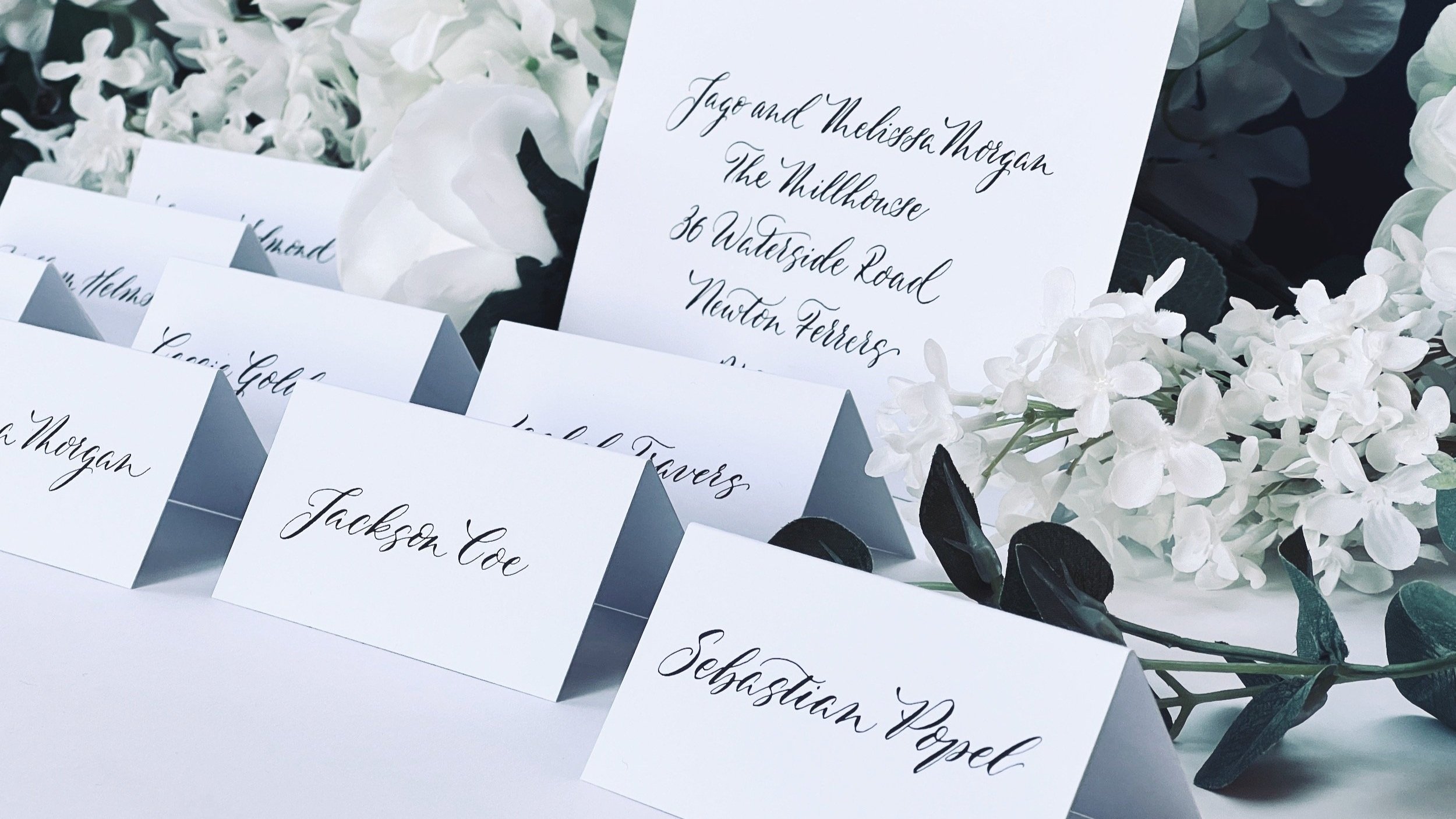 Delfont+Ink+slanted++modern+style+wedding+calligraphy+envelopes+placecards.jpg