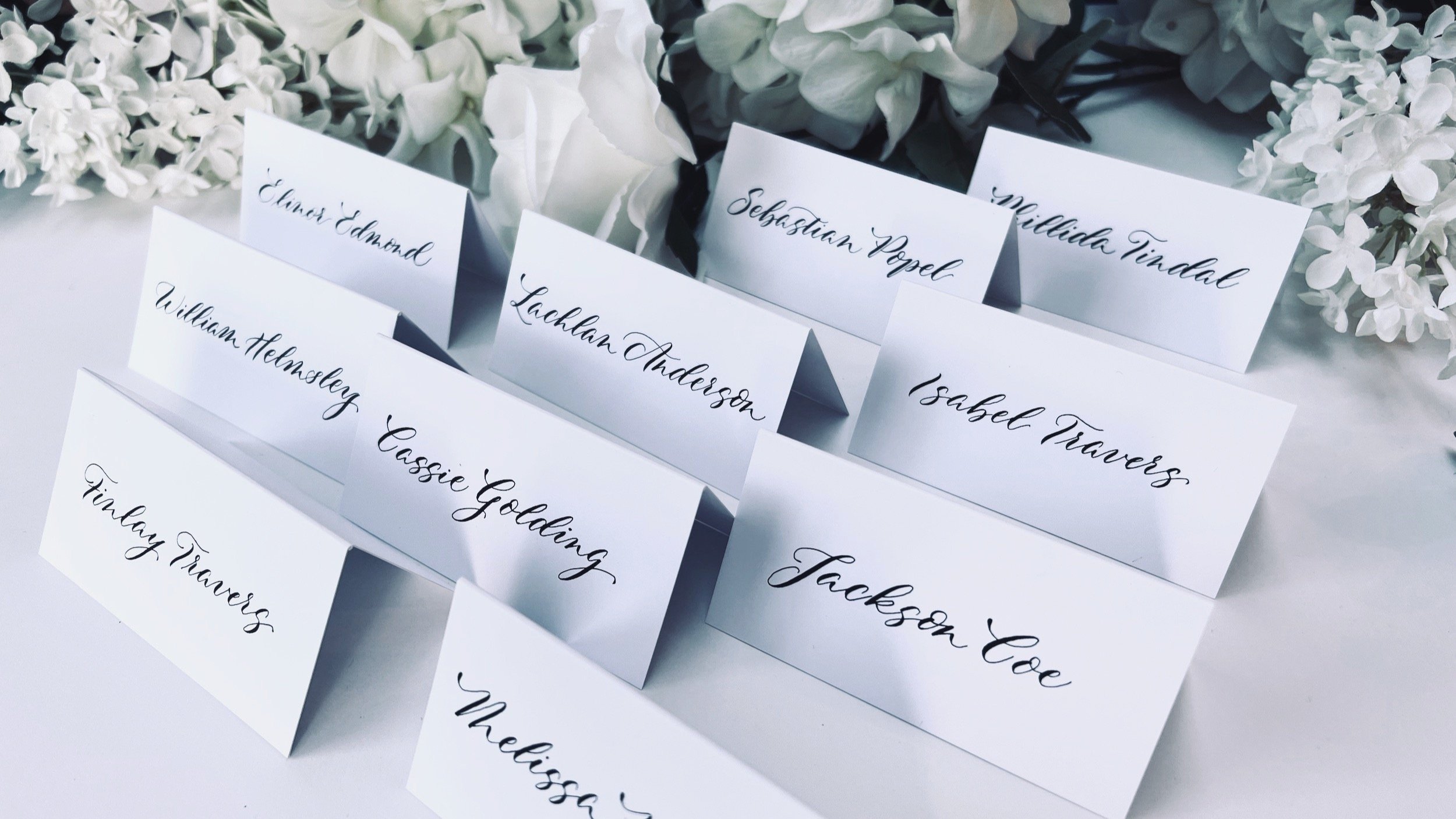 Delfont+Ink+Slanted+modern+calligraphy+style+wedding+placecards.jpg