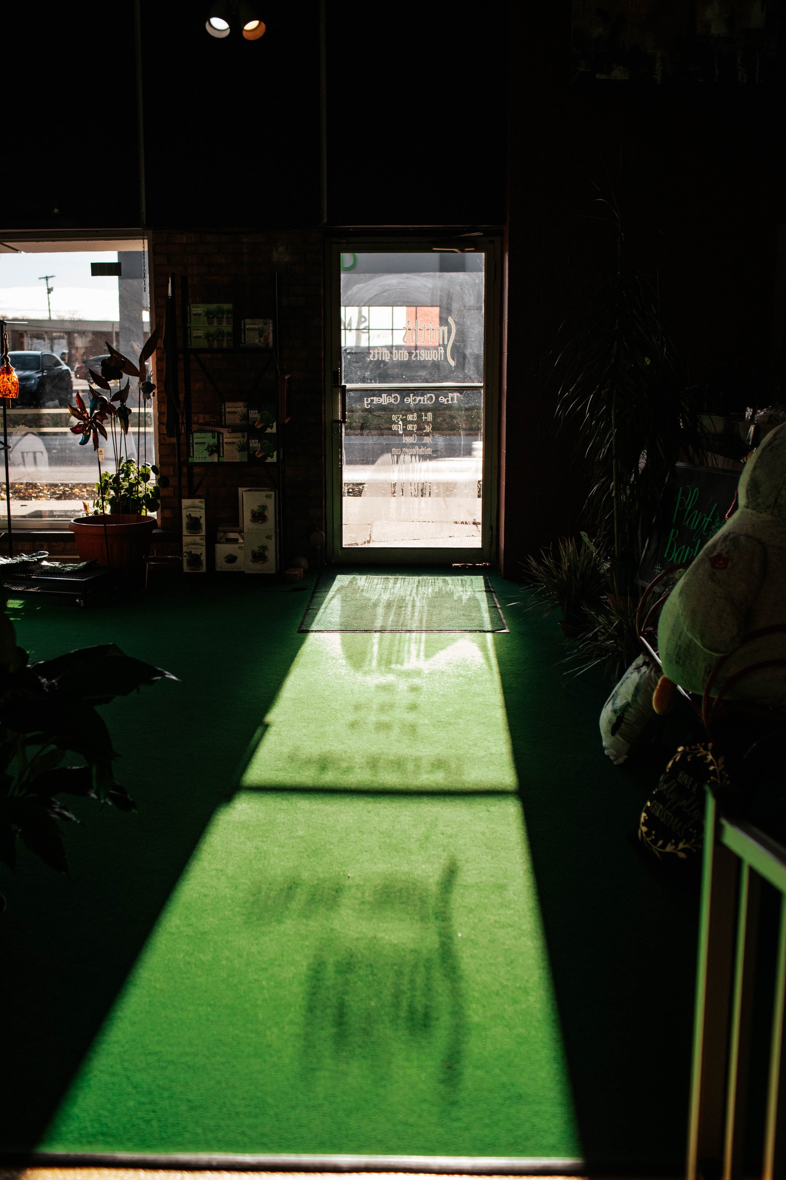  The bright morning sun casts shadows in the front end of the shop at Smith’s Flower Shop in Midland, Mich. on Nov. 11, 2021. 