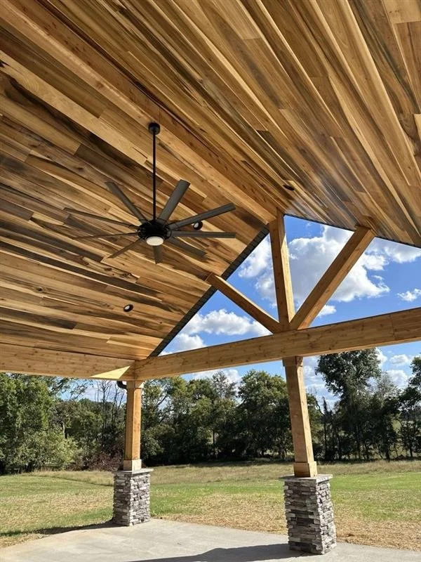 Rainbow poplar tongue and groove ceiling with natural color variation in a finished interior room.